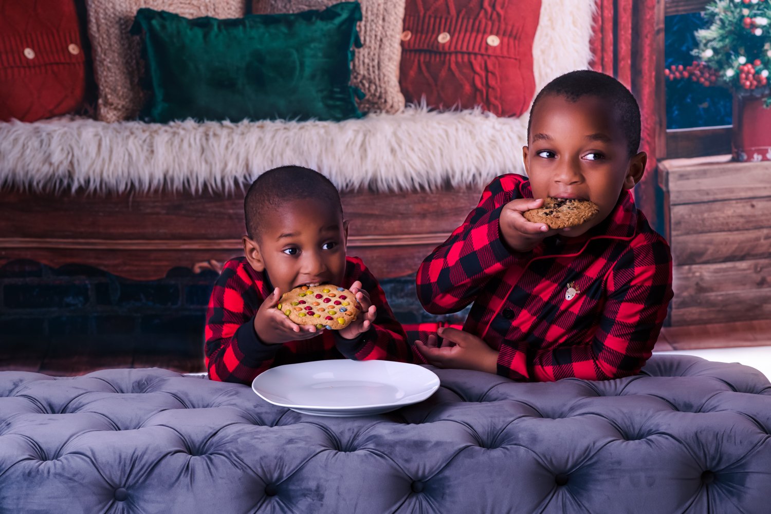 Siblings Sharing milk and cookies in a photoshoot and dressed and matching Pj's.jpg