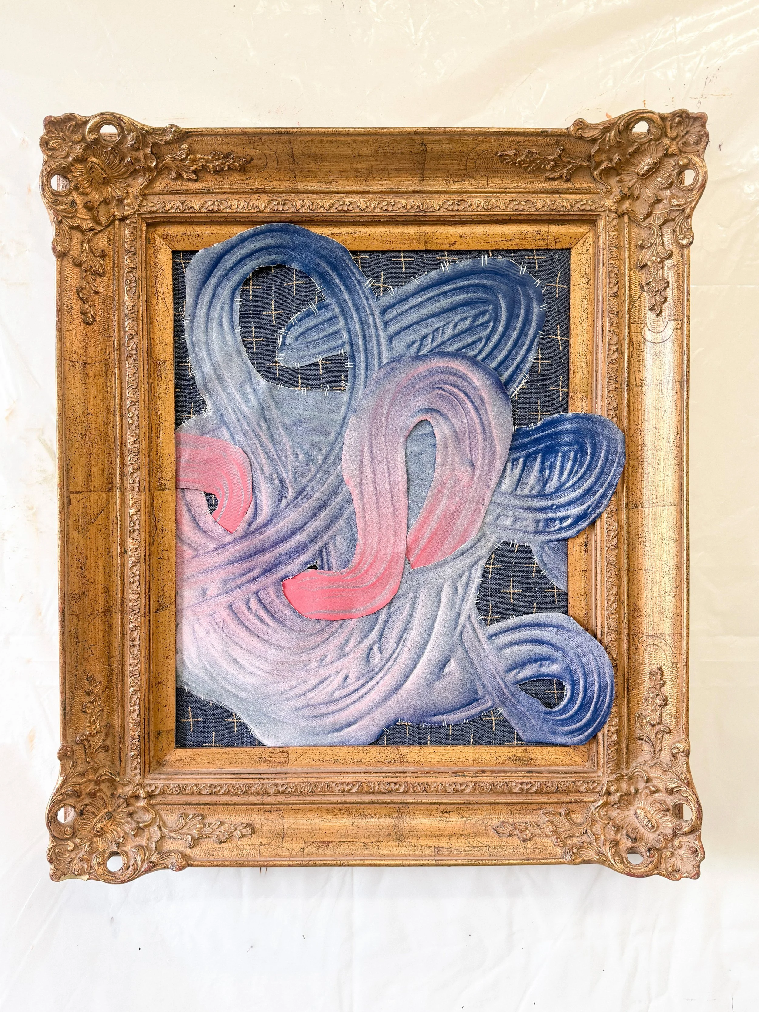 "Undone", salvaged paints, fabric and plastic with antique gilded frame. 27.5" x 22"