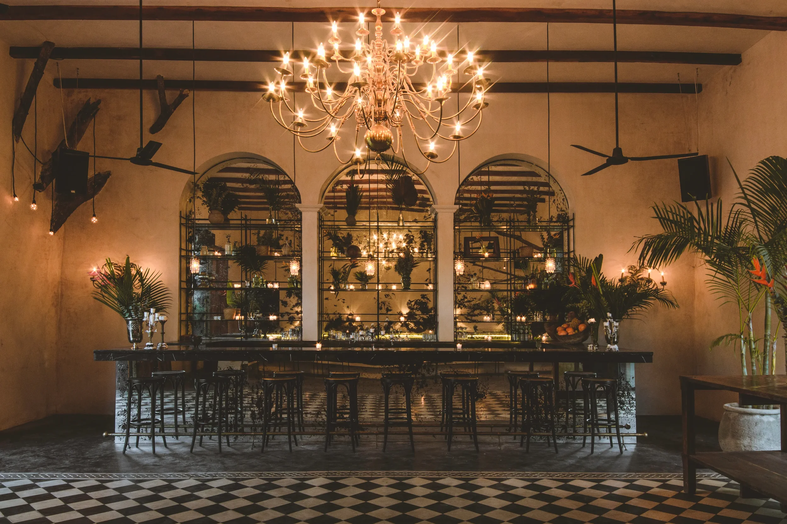 The Jungle room at Gitano Jungle, it feature colonial Spanish design complete with chandelier, mirrored bar and exposed wooden beams.