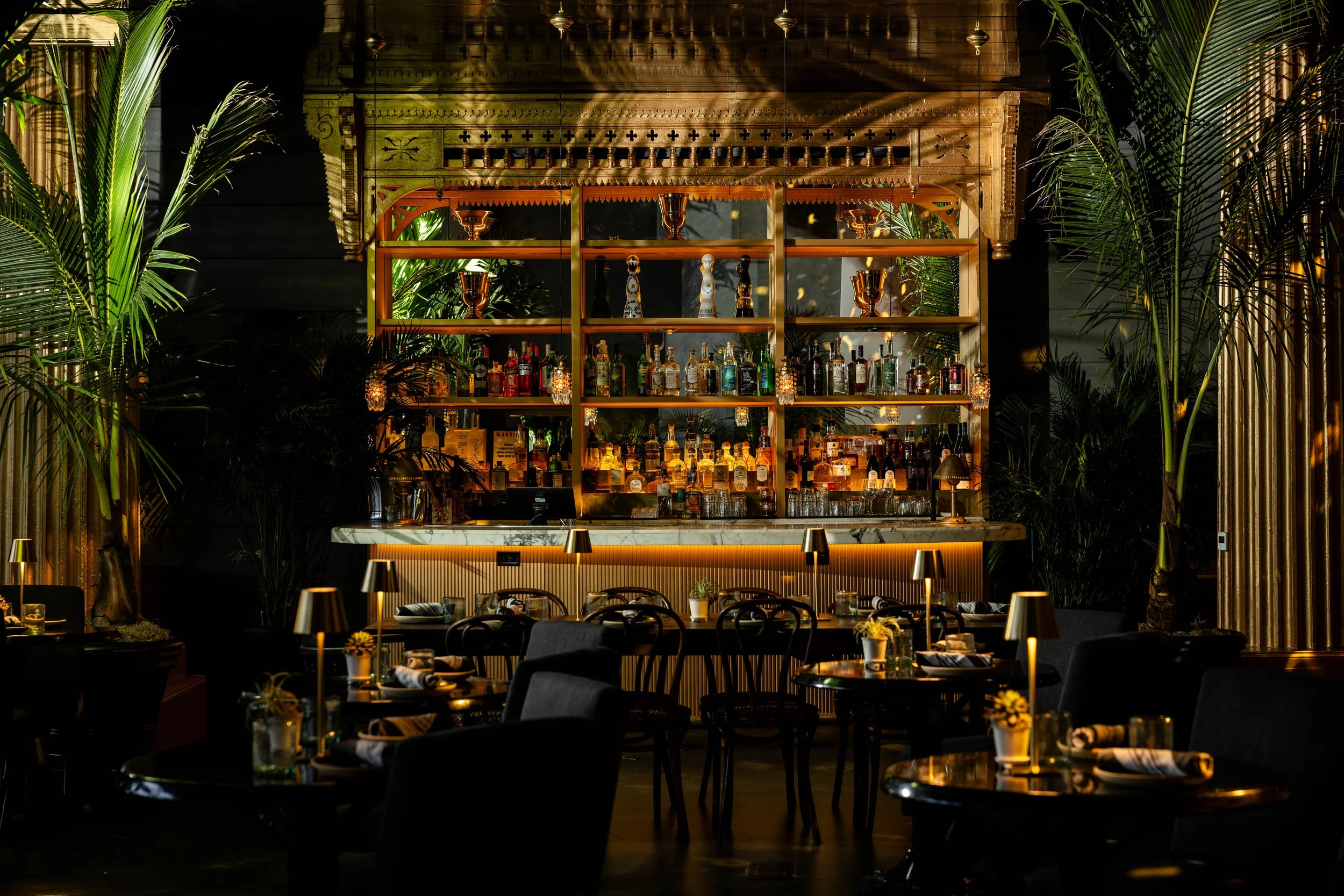 A stylish group of guests at GITANO NYC, gathered around a candlelit dinner table. Chic fashion, bold personalities, and bohemian glamour set the scene for an unforgettable night in the heart of the city.