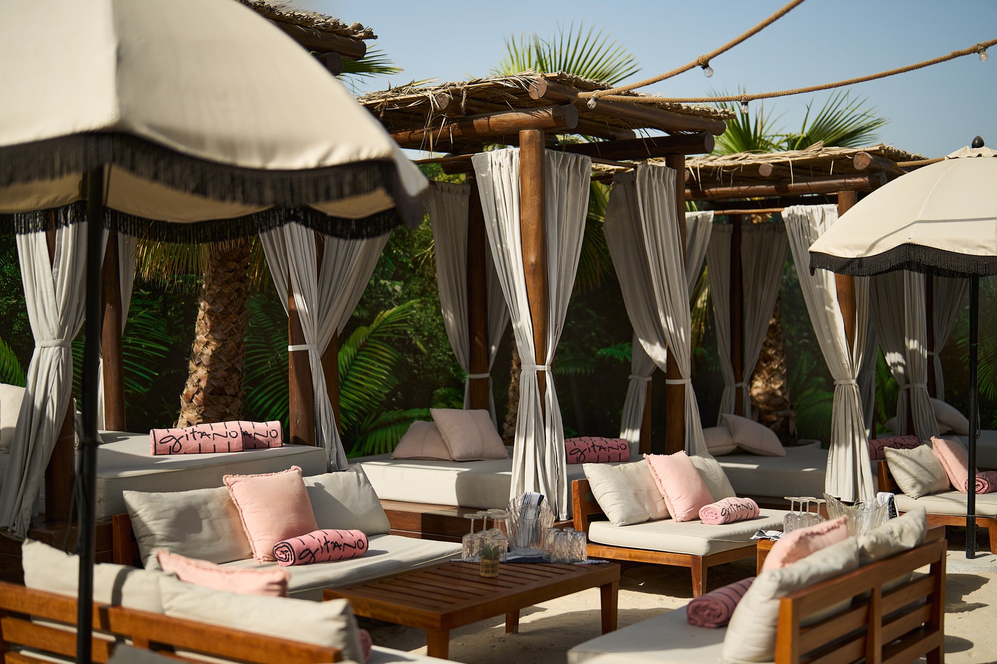 Guests dancing and celebrating at GITANO DUBAI, where tropical glamour, mezcal cocktails, and bohemian energy light up the night.