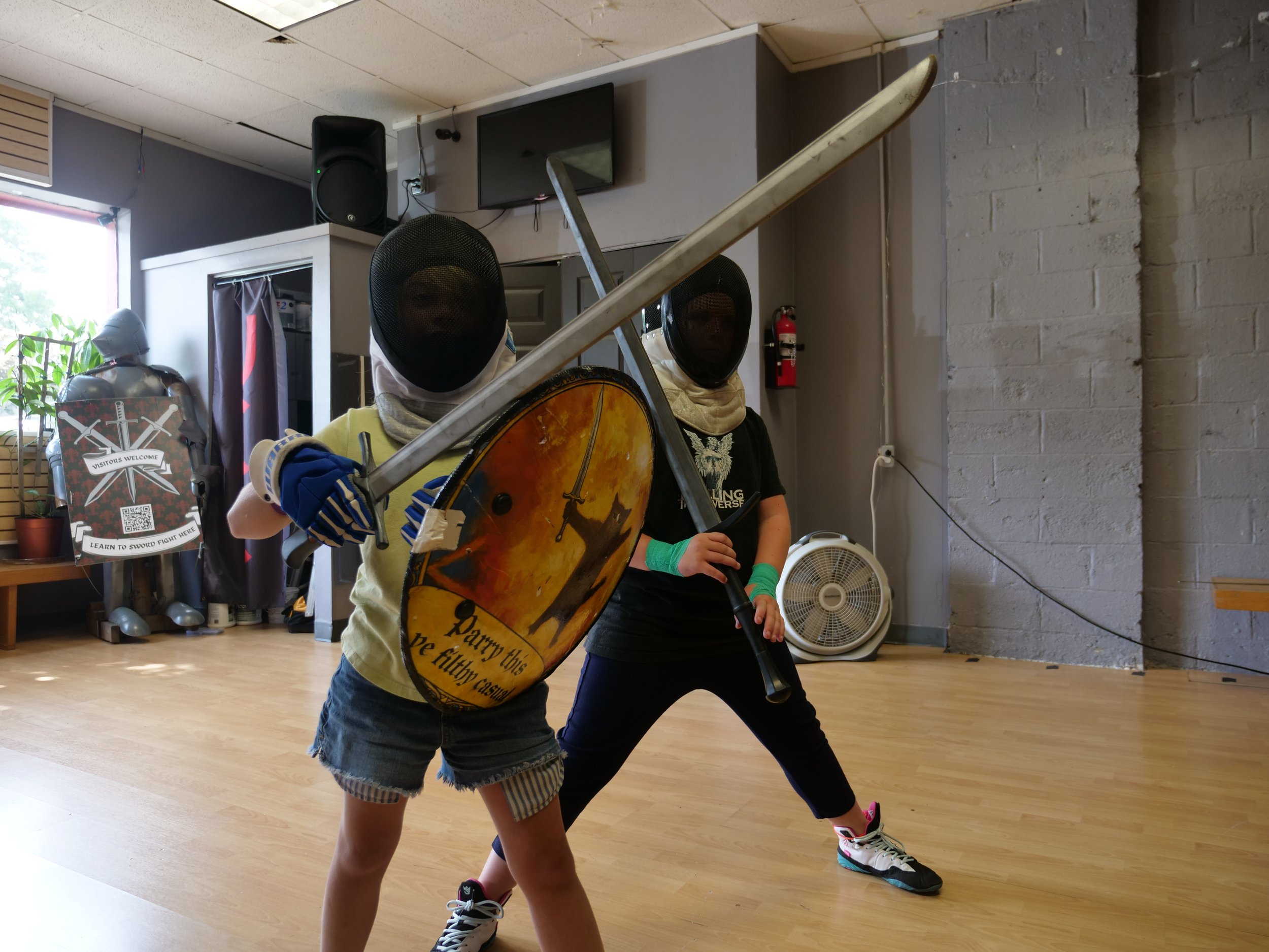 Kids ready to train in European swordsmanship knightforge academy