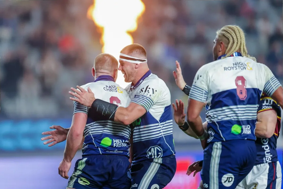 BLUES HOLD FIRM TO DEFEAT HIGHLANDERS
