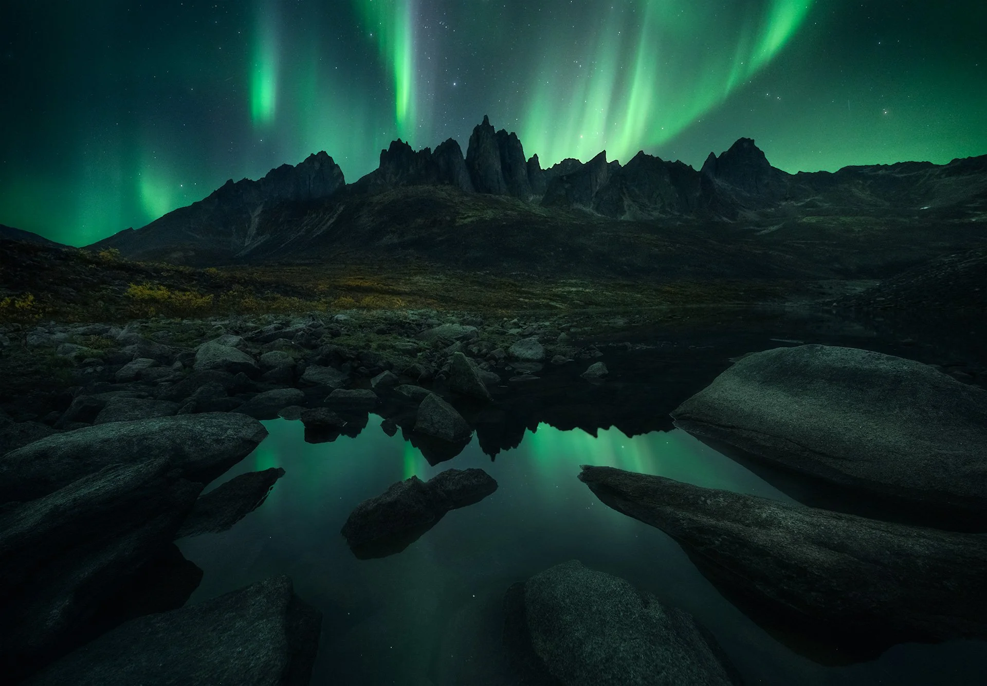 Mount Monolith with a clear reflection of the Aurora in Tombstone Territorial Park