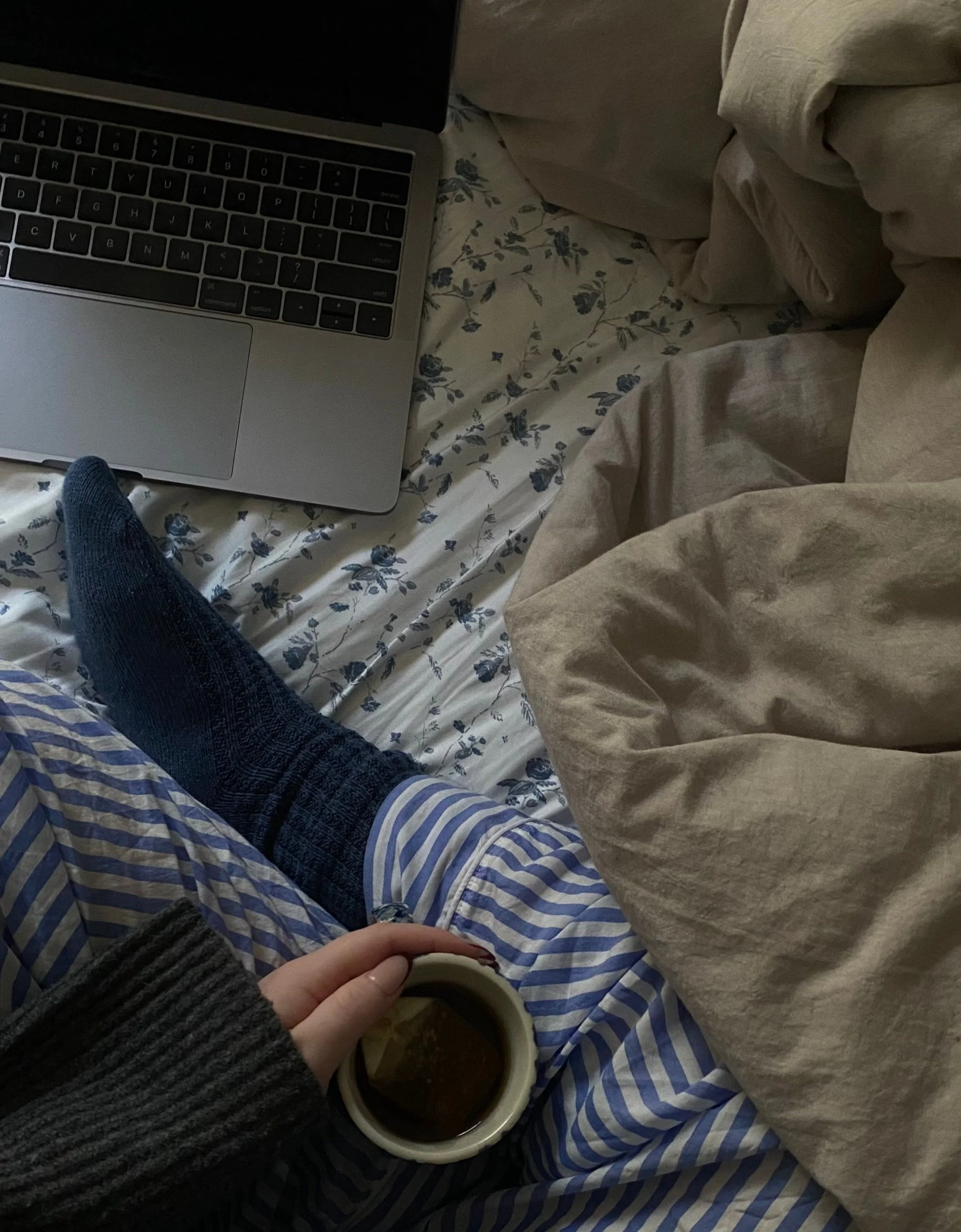 Graphic designer working from bed