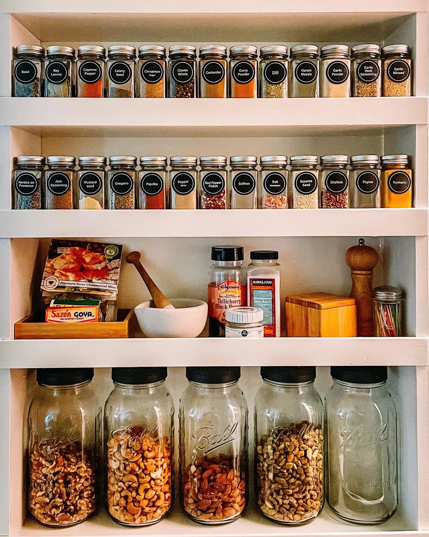 Spice (and nut!) situation on point 👌🏼 How happy would this setup make you every evening when you&rsquo;re cooking dinner and need to reach for your spices?! Swipe for the before ✨
&bull;
Spice jars from @amazon, mason jars from @ballcanning.
&bull