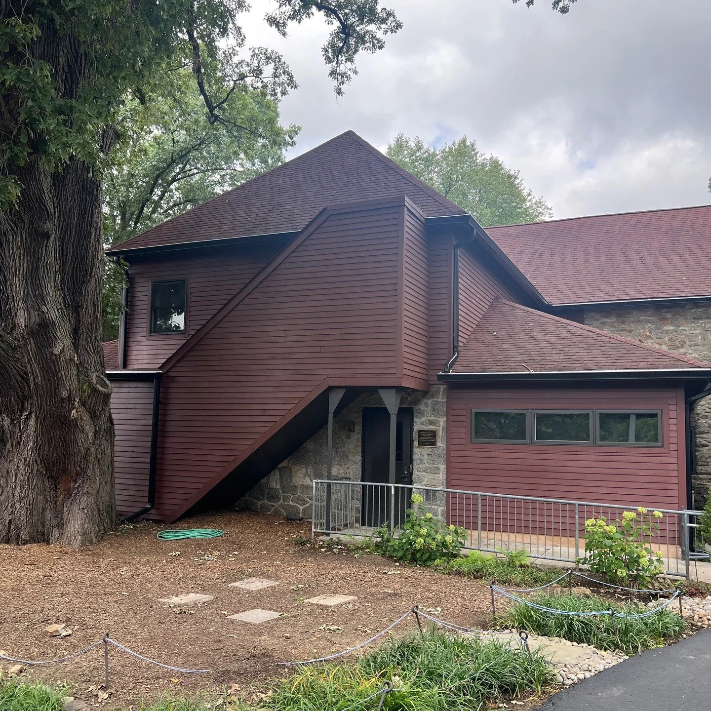 Giving the Blackburn Library in Wynnefield, PA, a fresh, long-lasting look! We tackled roof cleaning with soft wash techniques, brought the cedar wood back to life with detailed repairs, and gave it a sleek finish with solid staining and painting. Re