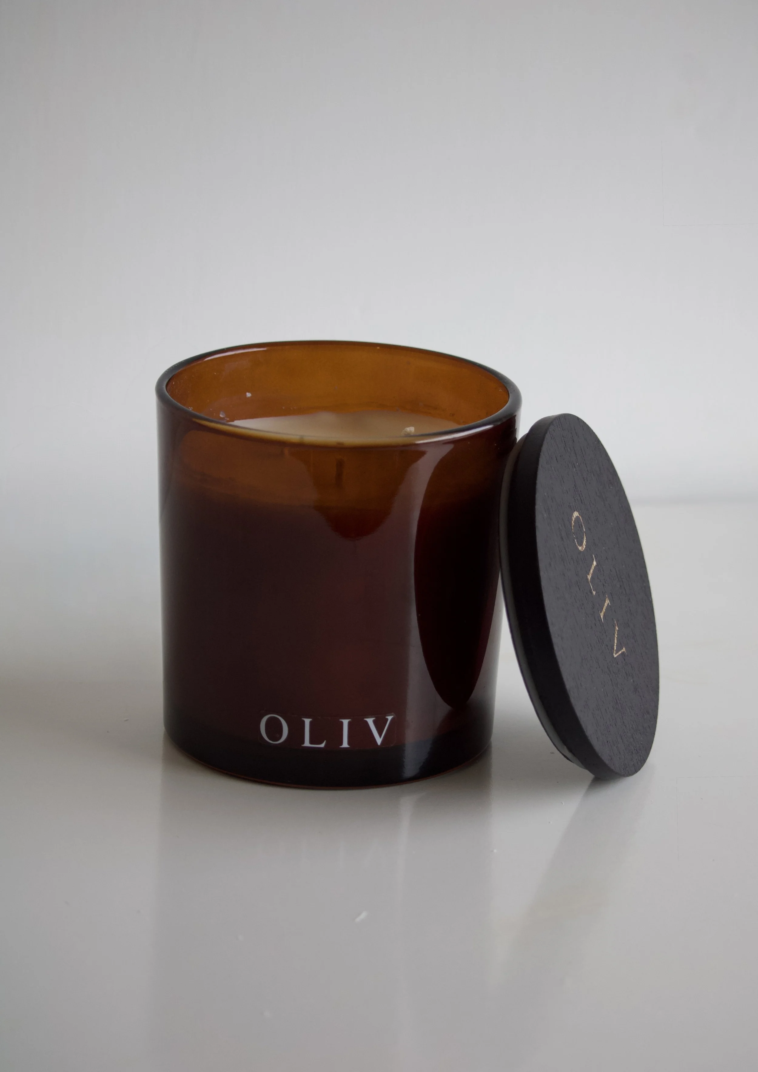 oliv candle triple wick amber glass jar.jpg
