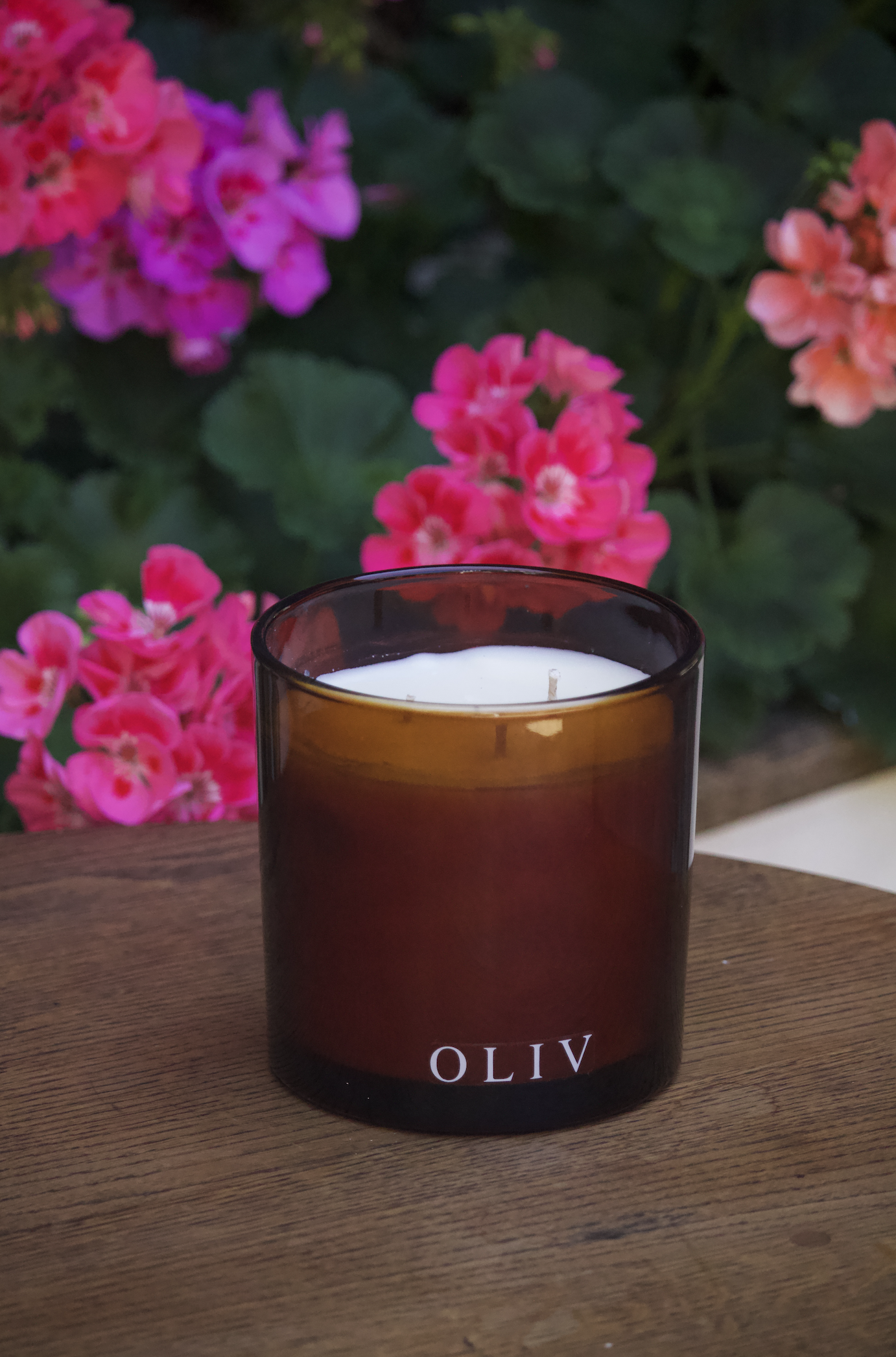 rose geranium amber glass triple wick candle oliv.png