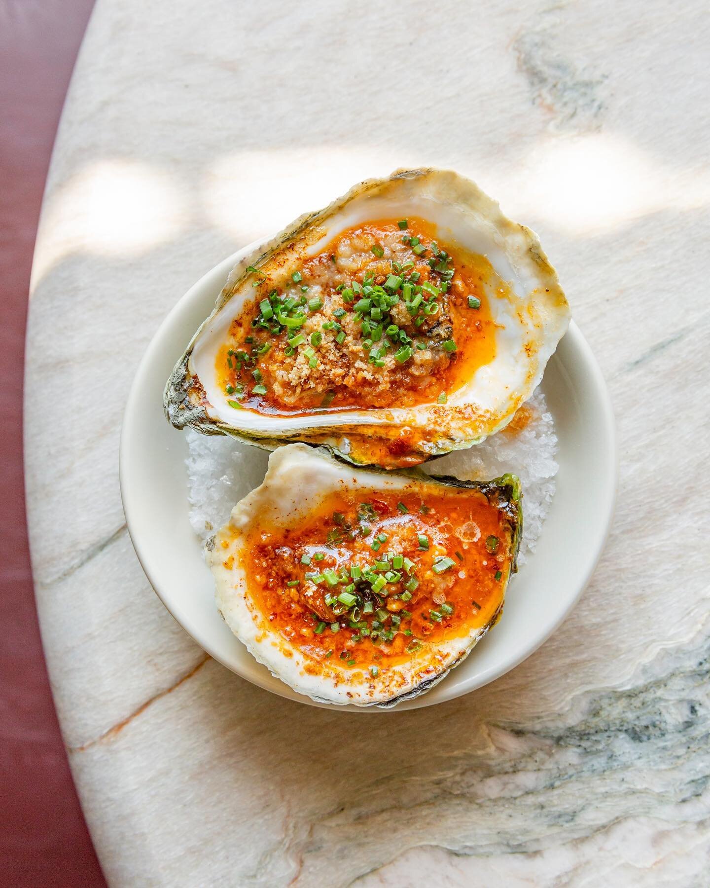 Happy Friday! Kick off your weekend with one of our staples &mdash; broiled Maine oysters with garlic chili butter + bread crumbs 📸 @starchefs