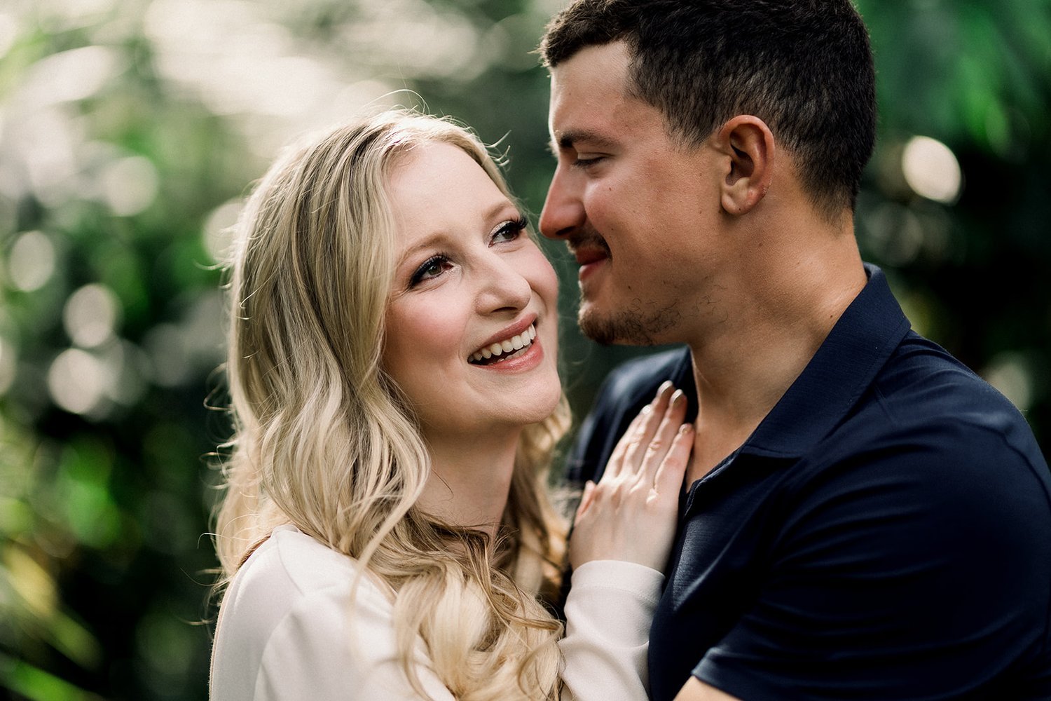 Glamorous smile engaged couple at Bloedel Conservatory Vancouver, BC