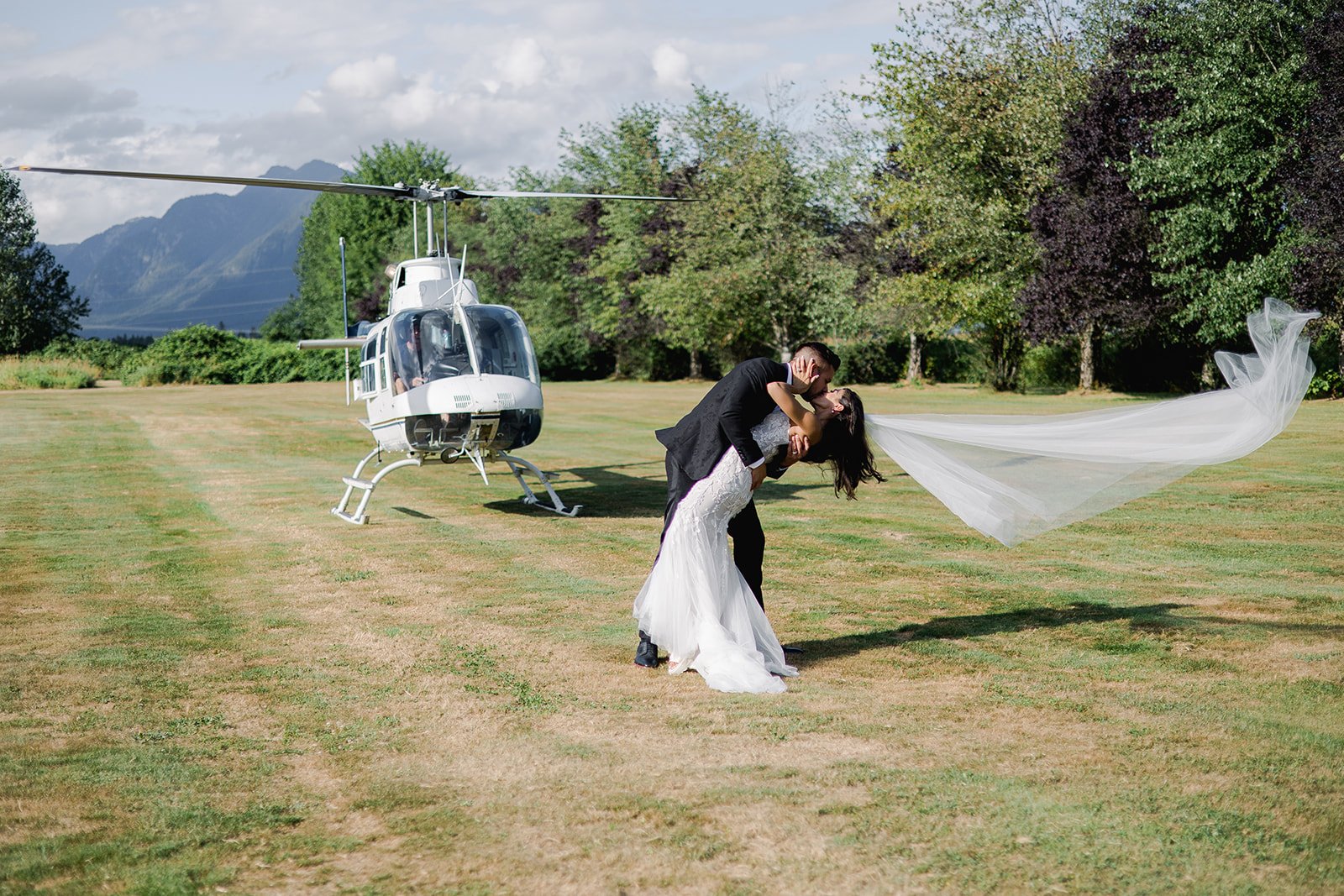 Despite FAA regulations, newly married Vancouver couple passionately kisses dangerously to helicopter 