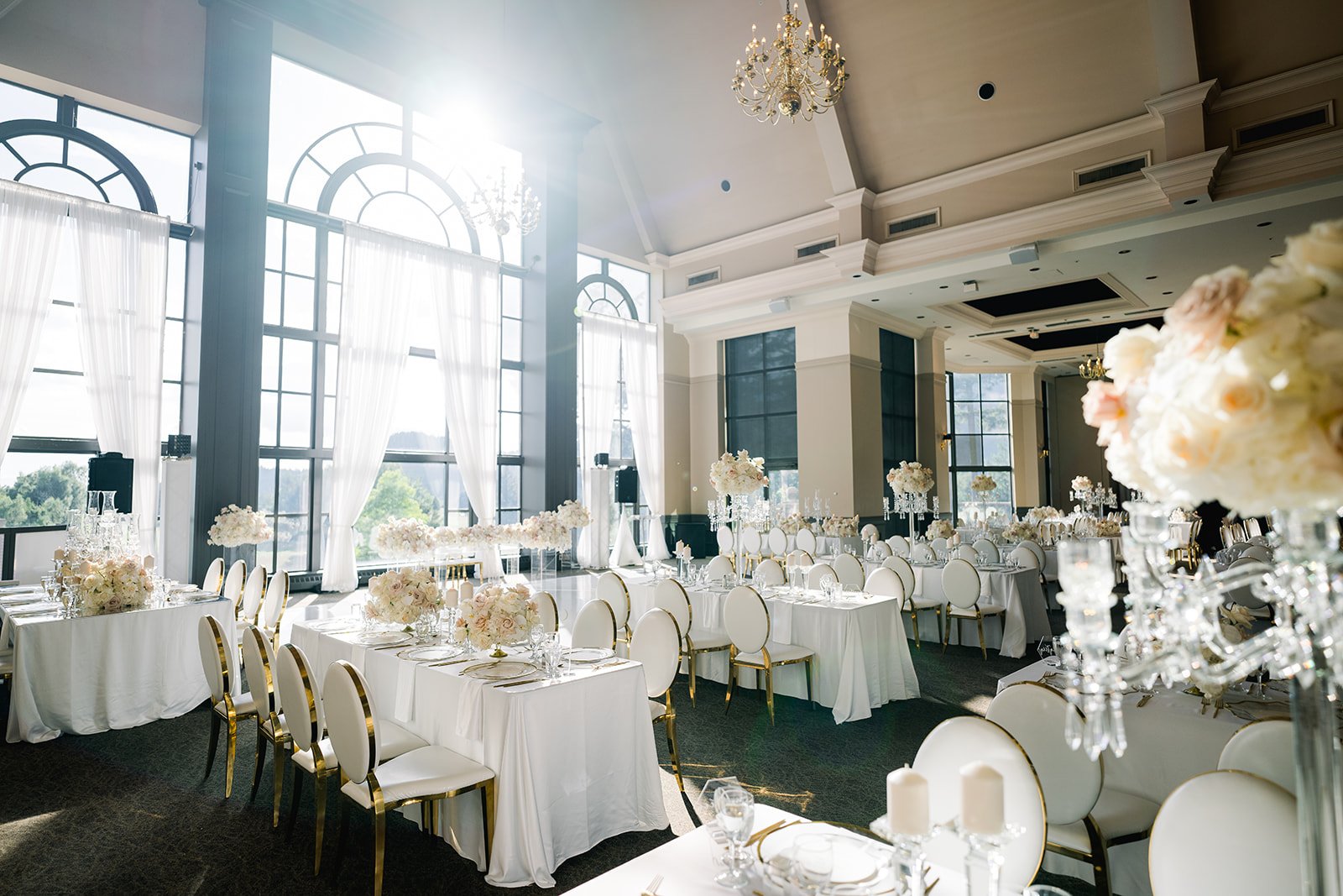 Large ballroom is bathed in golden hour light before reception at Swaneset in Vancouver BC