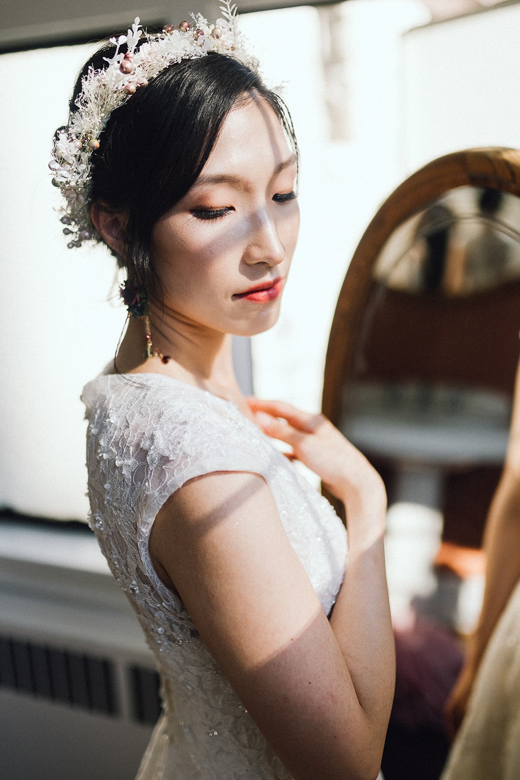 asian bride in boho headpiece and white lace wedding gown at Cecil Green Park House in Vancouver, BC.