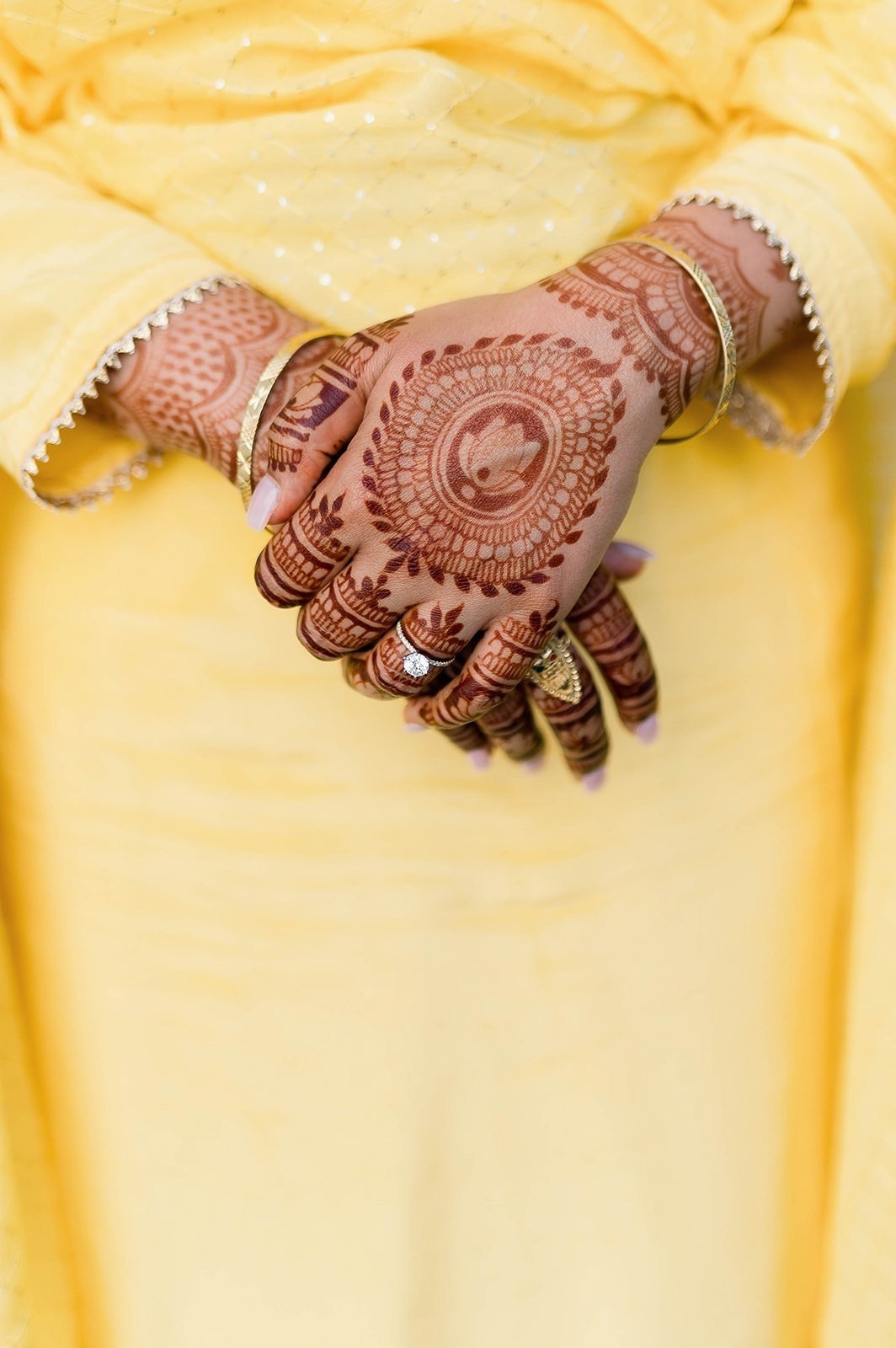 close up of henna details on bride's hands during her wedding at Cecil Green Parkhouse.