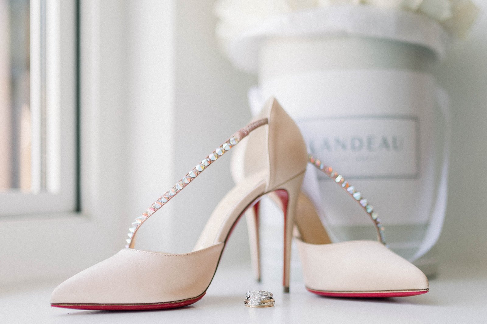 Sparkly large engagement ring next to bridal shoes at hart house wedding in Vancouver BC 