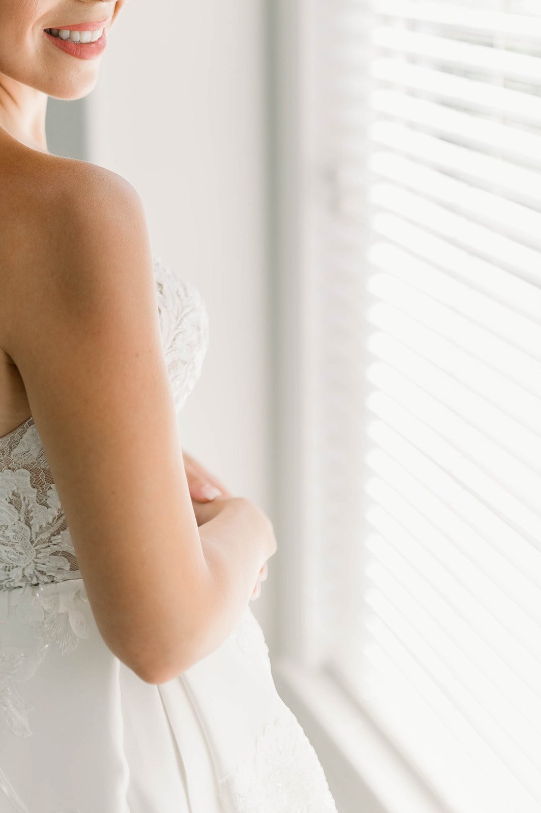 Bride shows off wedding dress and dental work before hart house wedding ceremony
