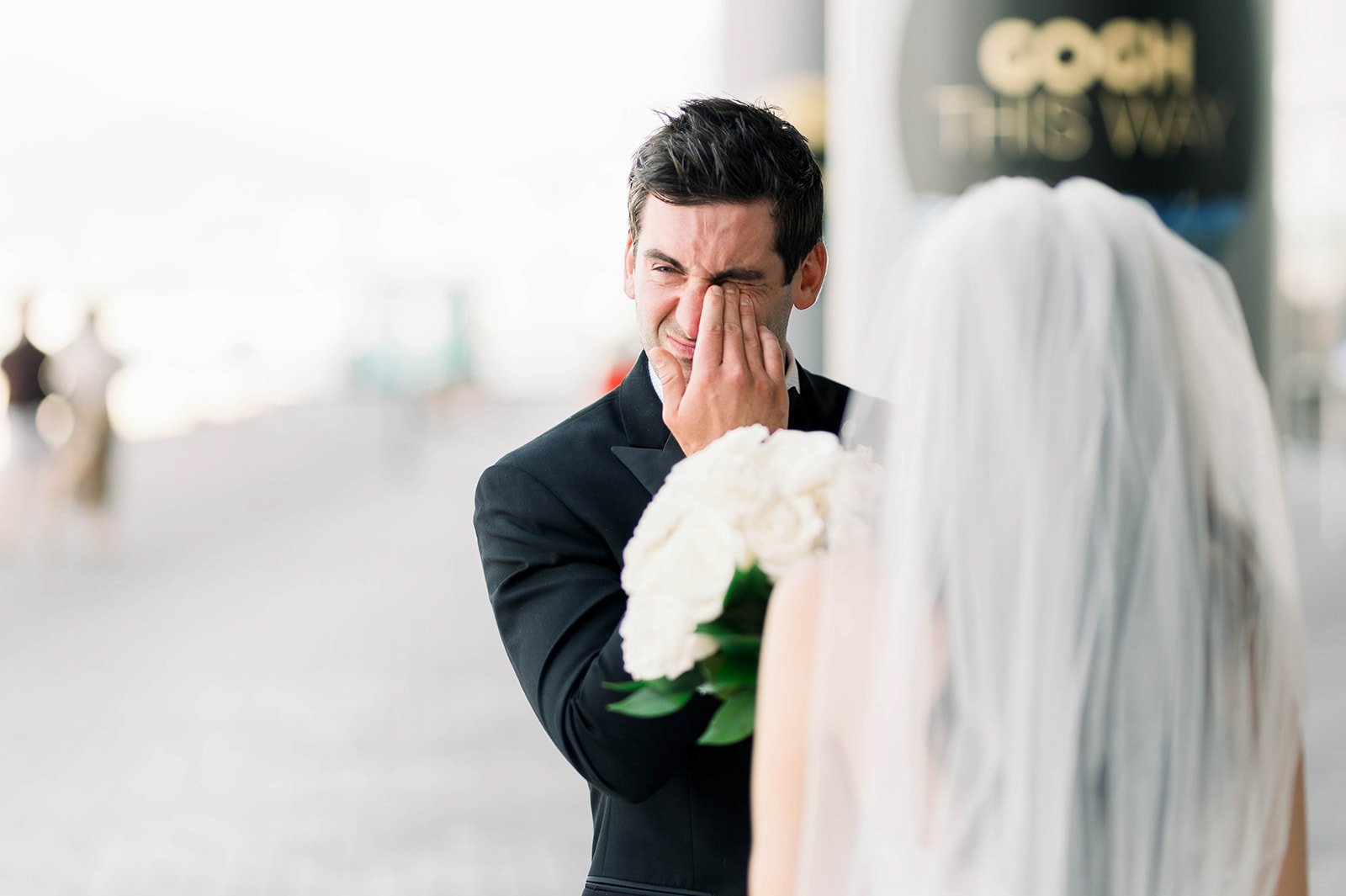 Groom cries after seeing bride, presumably from happiness.  