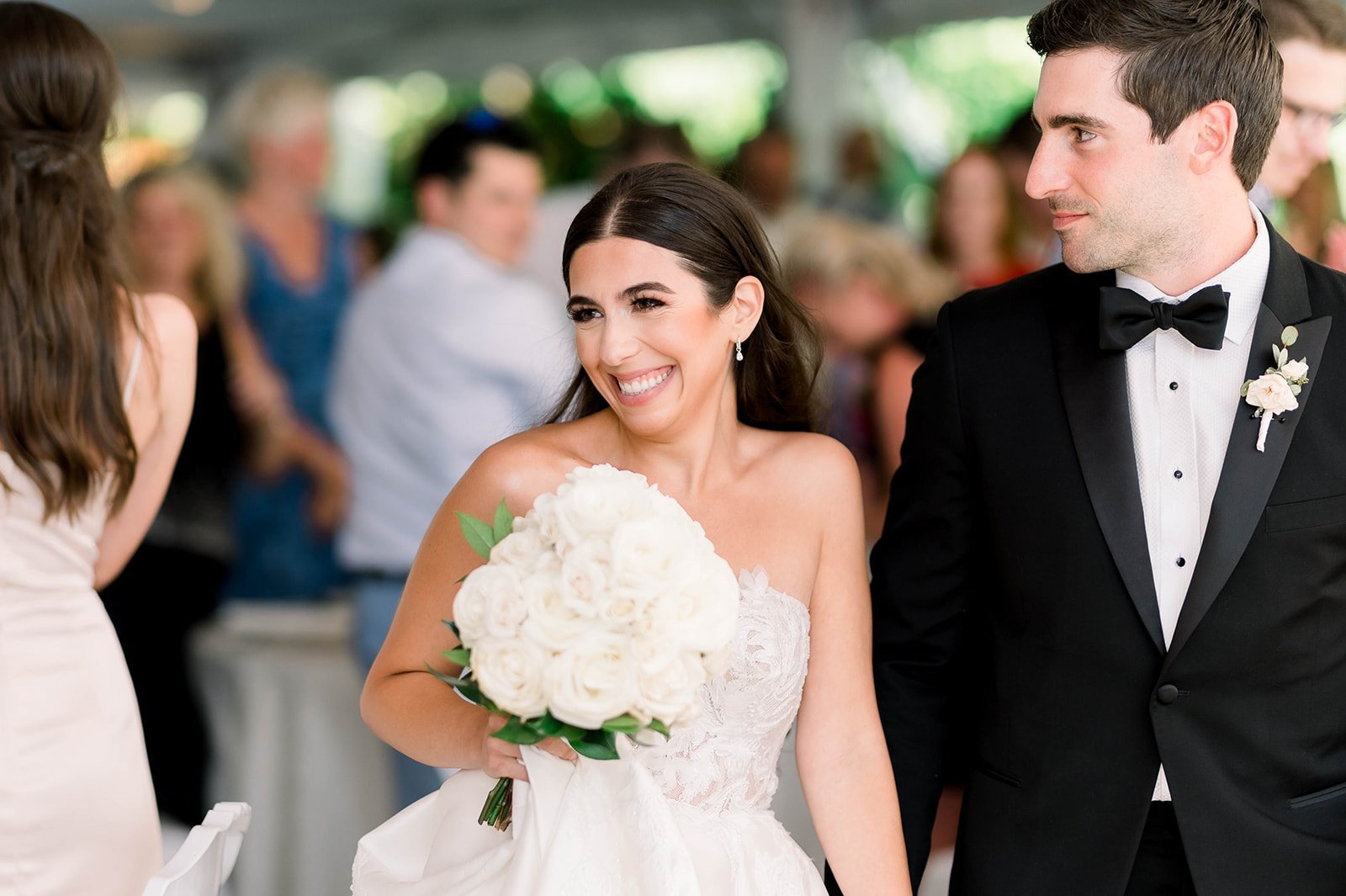 Pretty Bride smiles demurely as her groom escorts her into Hart House in Vancouver BC.  