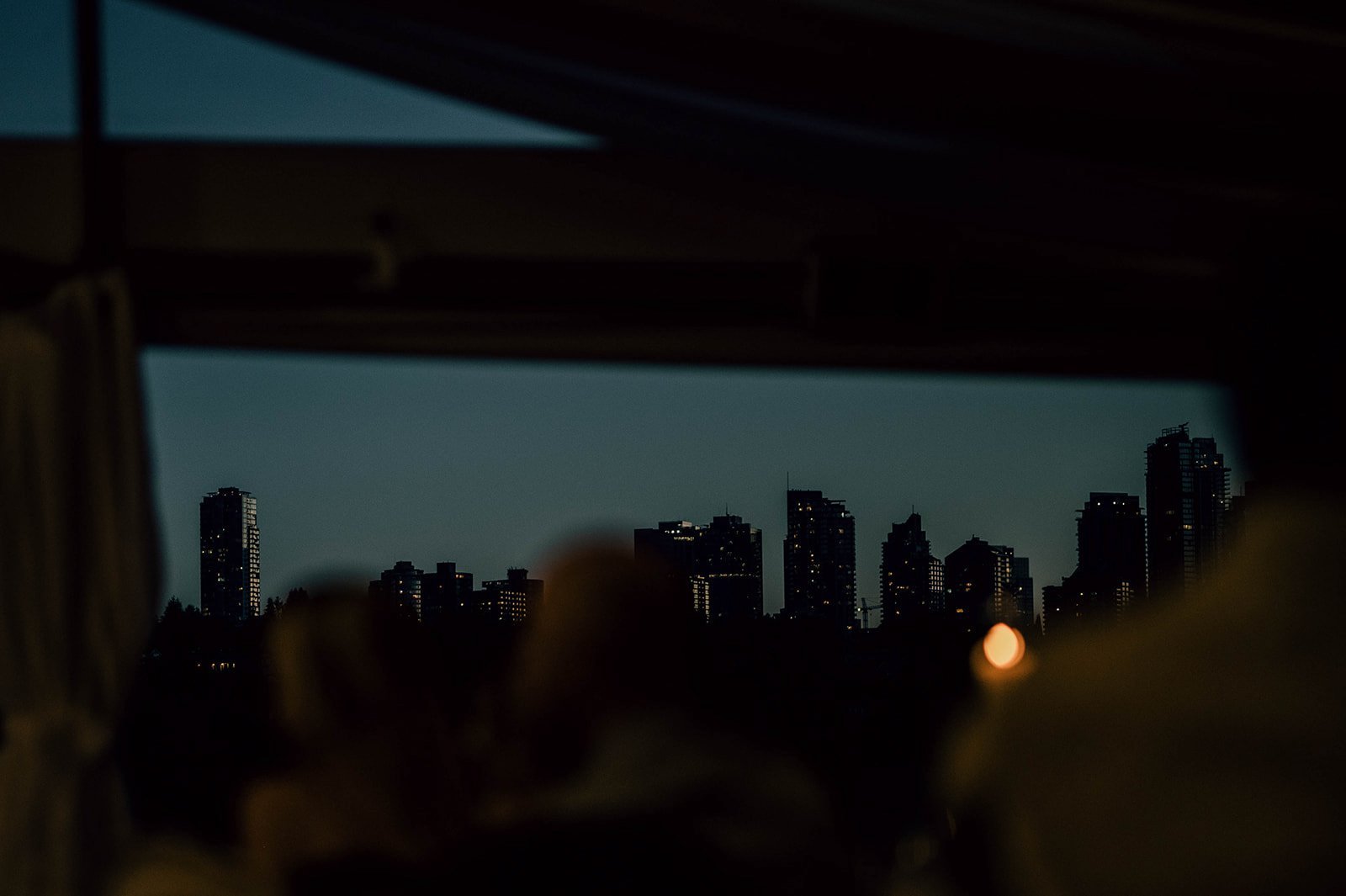 A city skyline descends into darkness in Vancouver, BC. 