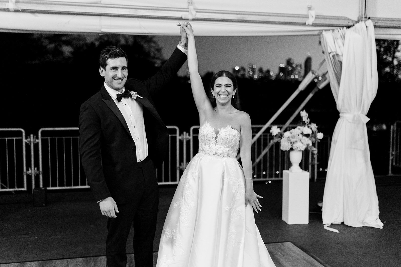 Bride and groom finish first dance with hands raised at Hart House in Vancouver BC.
