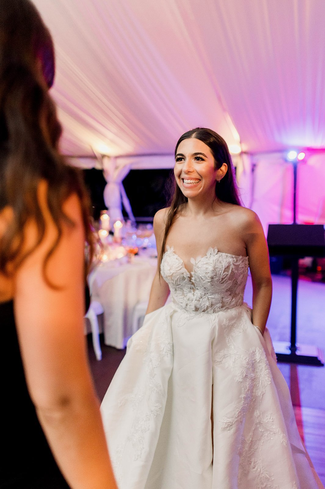 Bride dances at Hart House reception with wedding guests.