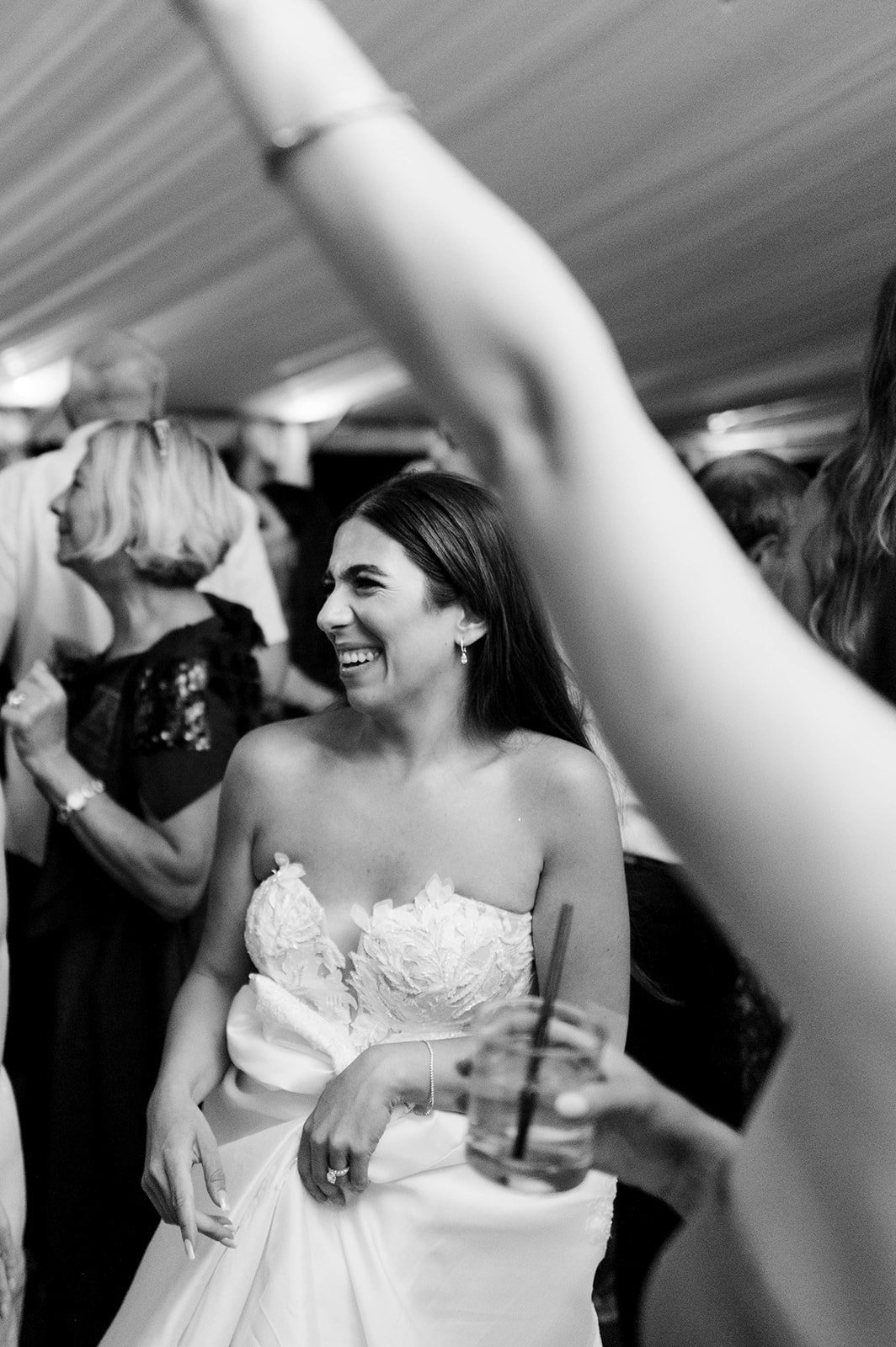 Bride smiles as she enjoys the dance-floor at Hart House in Vancouver BC. 