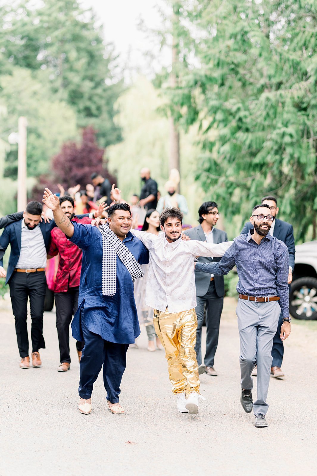 Boys dance as they enter mayian ceremony for Sikh wedding on Vancouver Island.