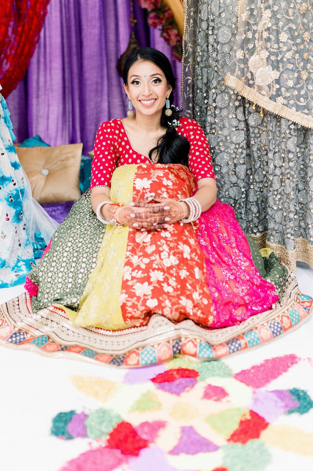 Indian bride smiles at Beautiful life studios photographer as she awaits her Mayian Ceremony. 