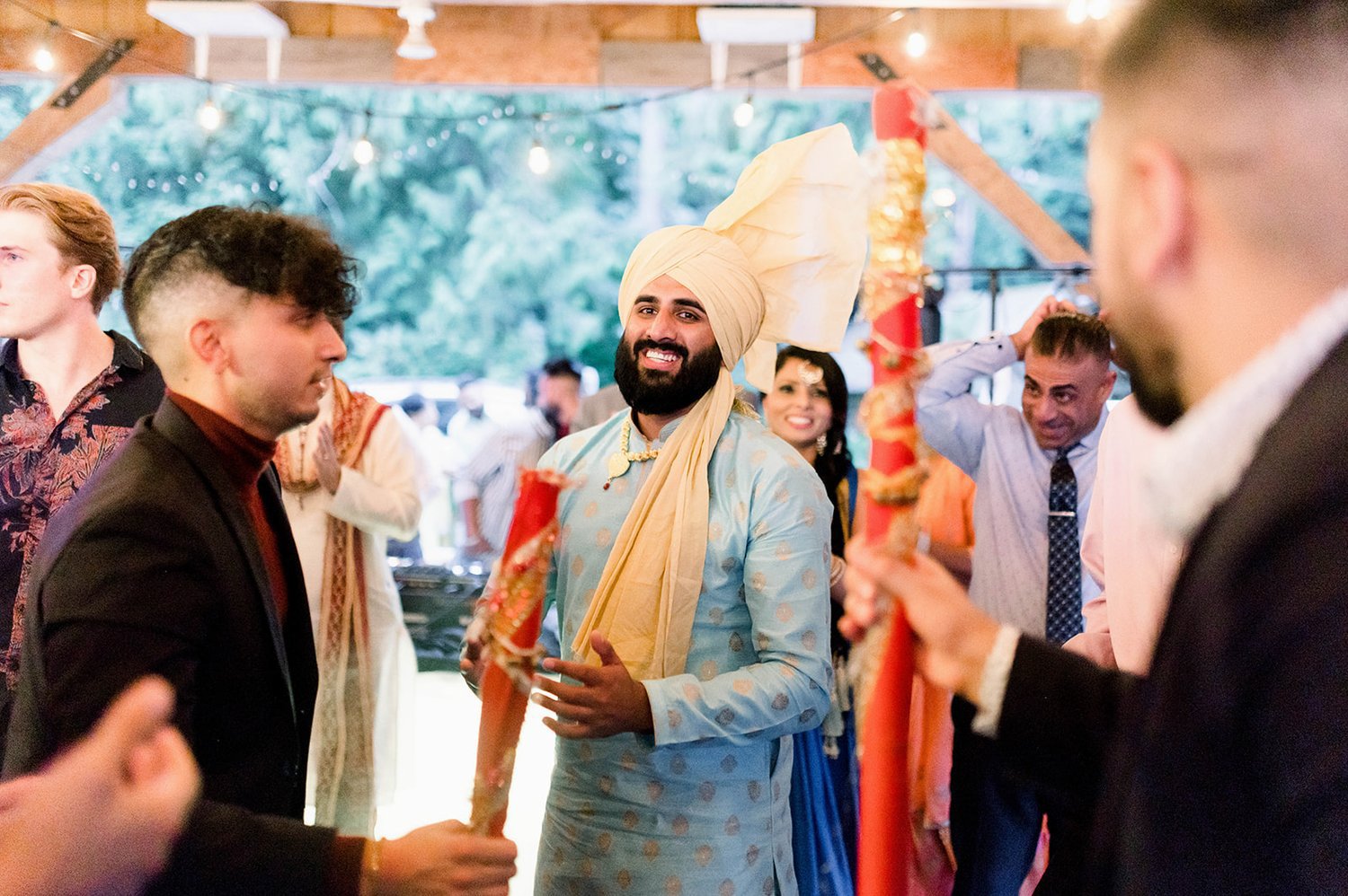 Groom dances with guests during his Jaggo at his Indian Wedding in Victoria BC.