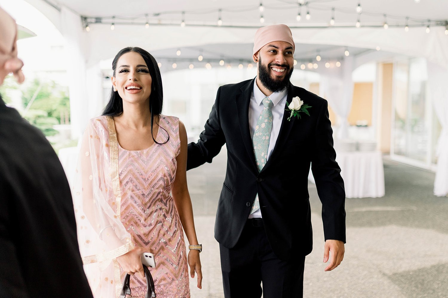Wedding guest smile as they arrive at a Sikh Ceremony in Victoria BC