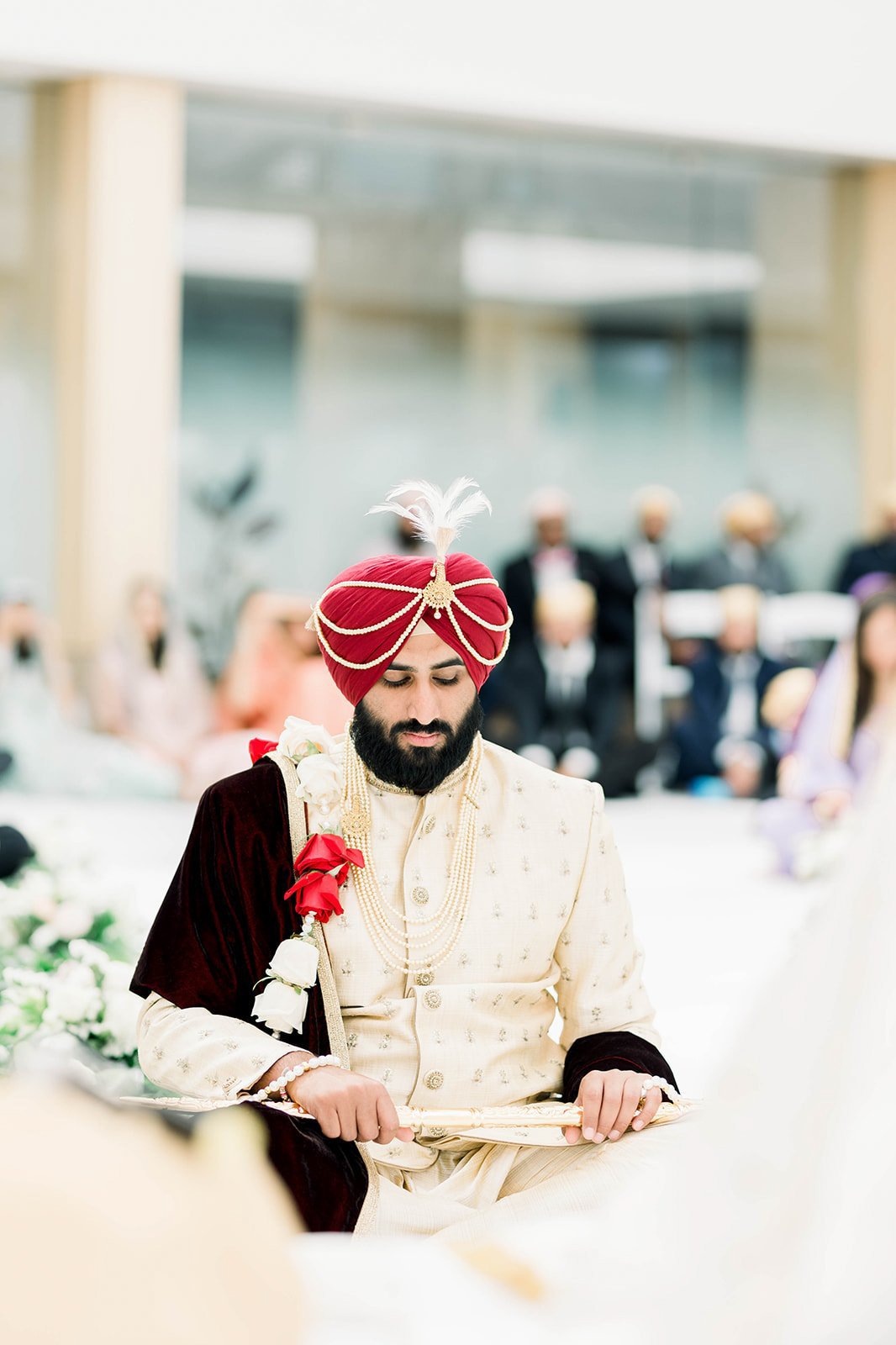 An indian groom waits for his bride in a punjabi wedding ceremony in Victoria BC