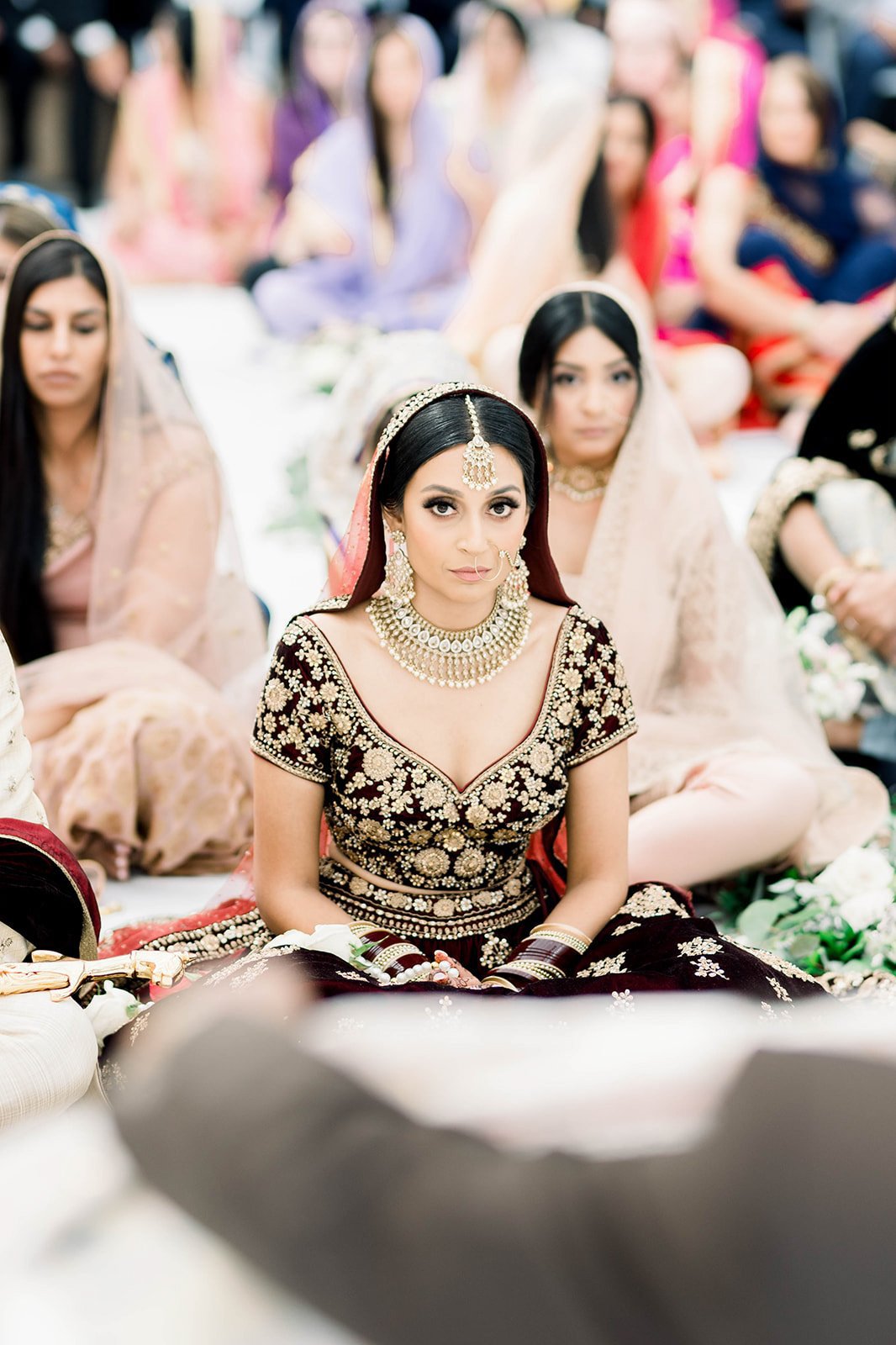 An Indian bride sits in front of the alter in a indian wedding ceremony in Victoria BC 