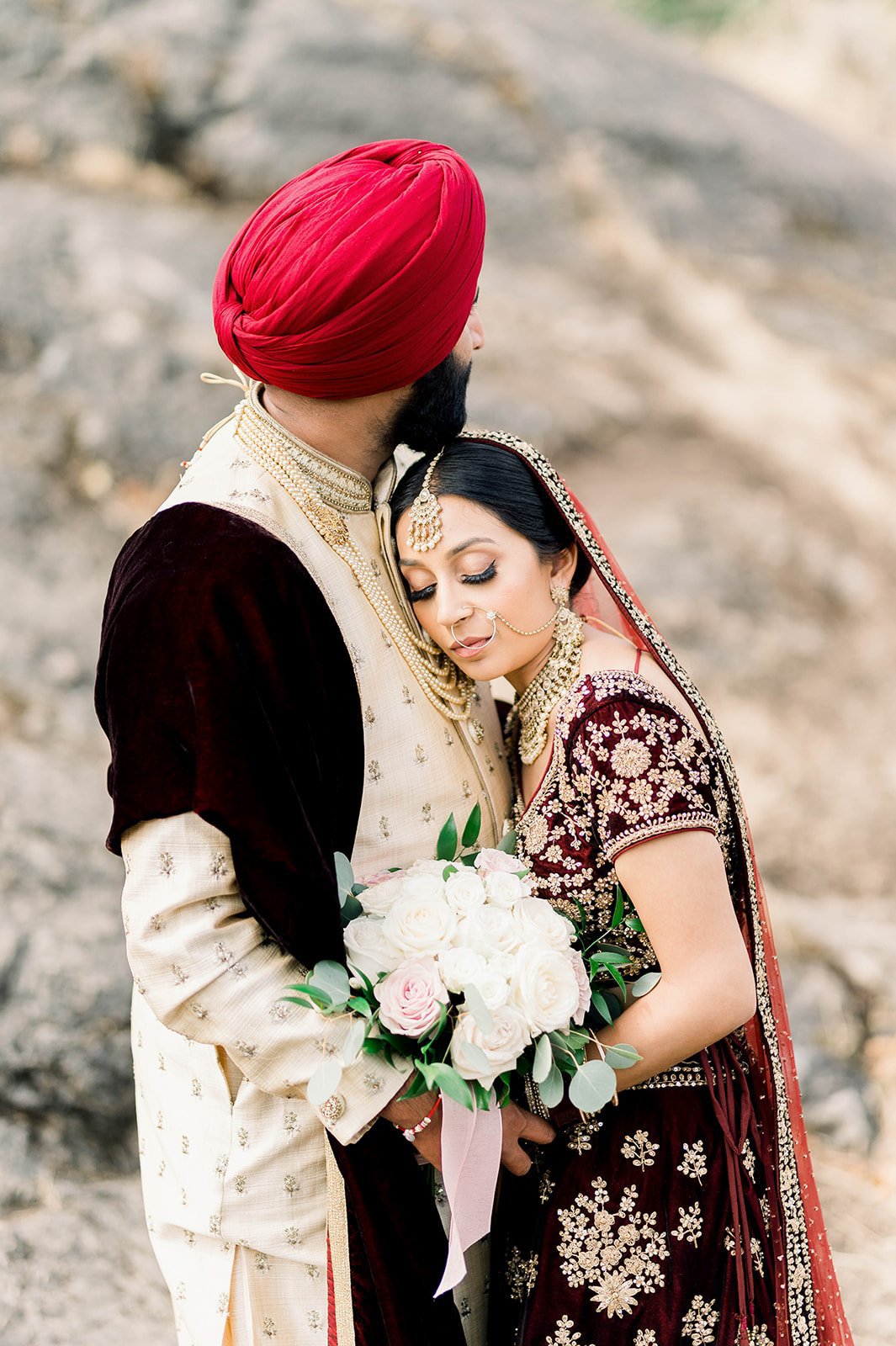 A bride cuddles on her grooms chest in Victoria BC