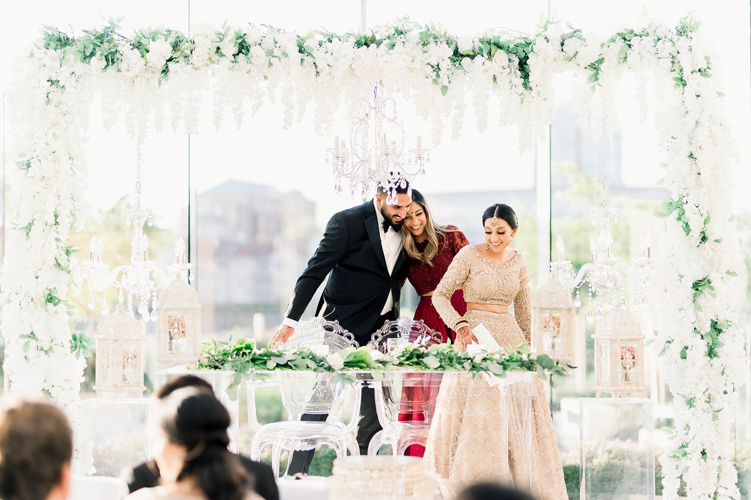 A bride and groom take a seat at their head table in Victoria BC  
