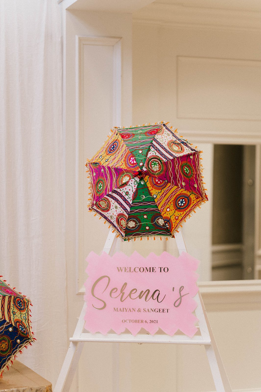 a pink signs welcomes guest to serena's Maiyan and Sangeet