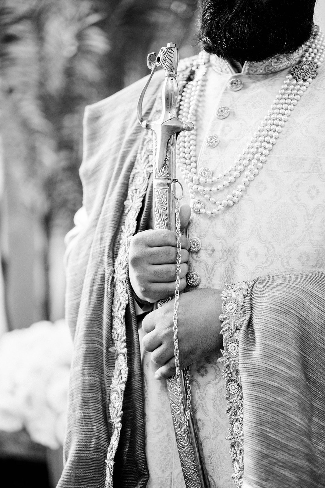 A traditional Indian groom clutches a sword before his wedding ceremony in Surrey, BC. 
