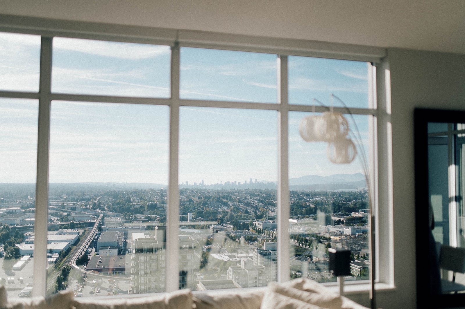 Cityscape through an apartment window in Vancouver, BC. Beautiful Life Studios BC.