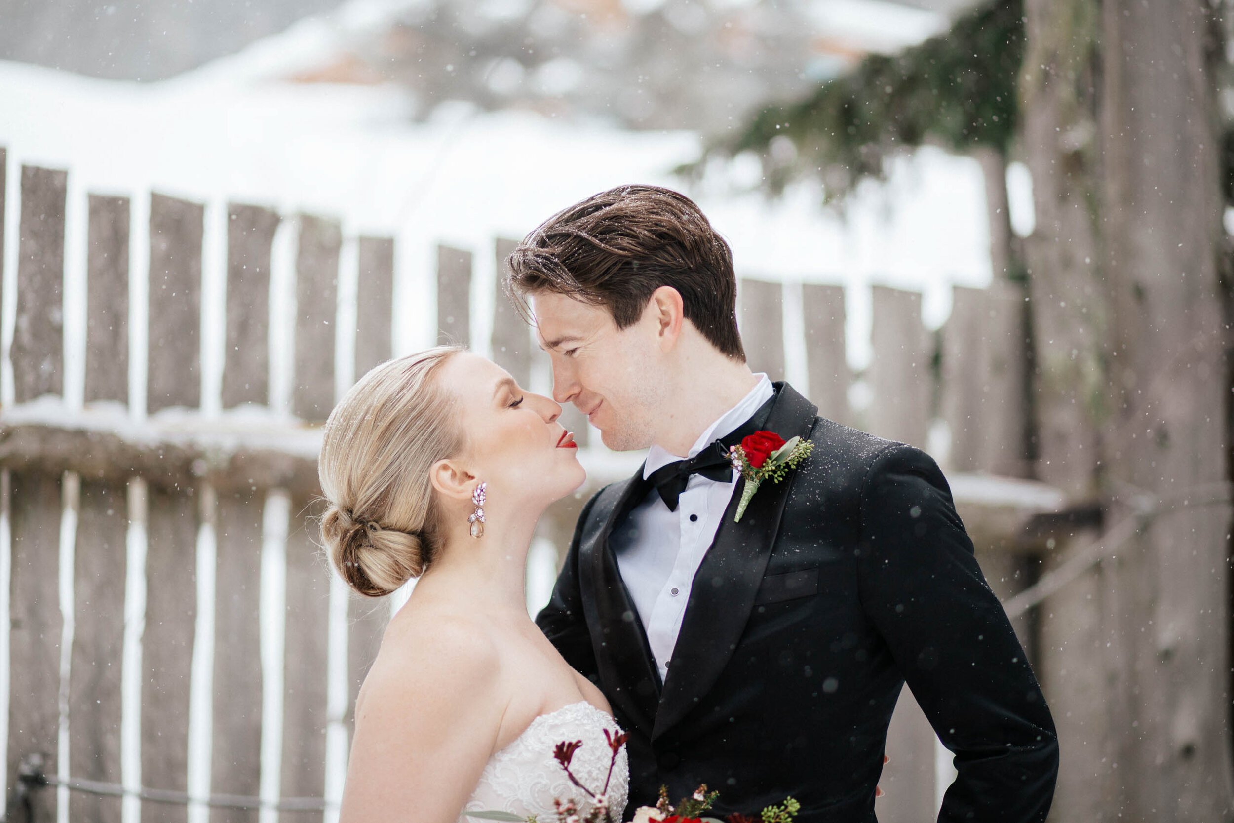 A bride sticks her tough out at her groom in a cheeky moment in Whistler BC.