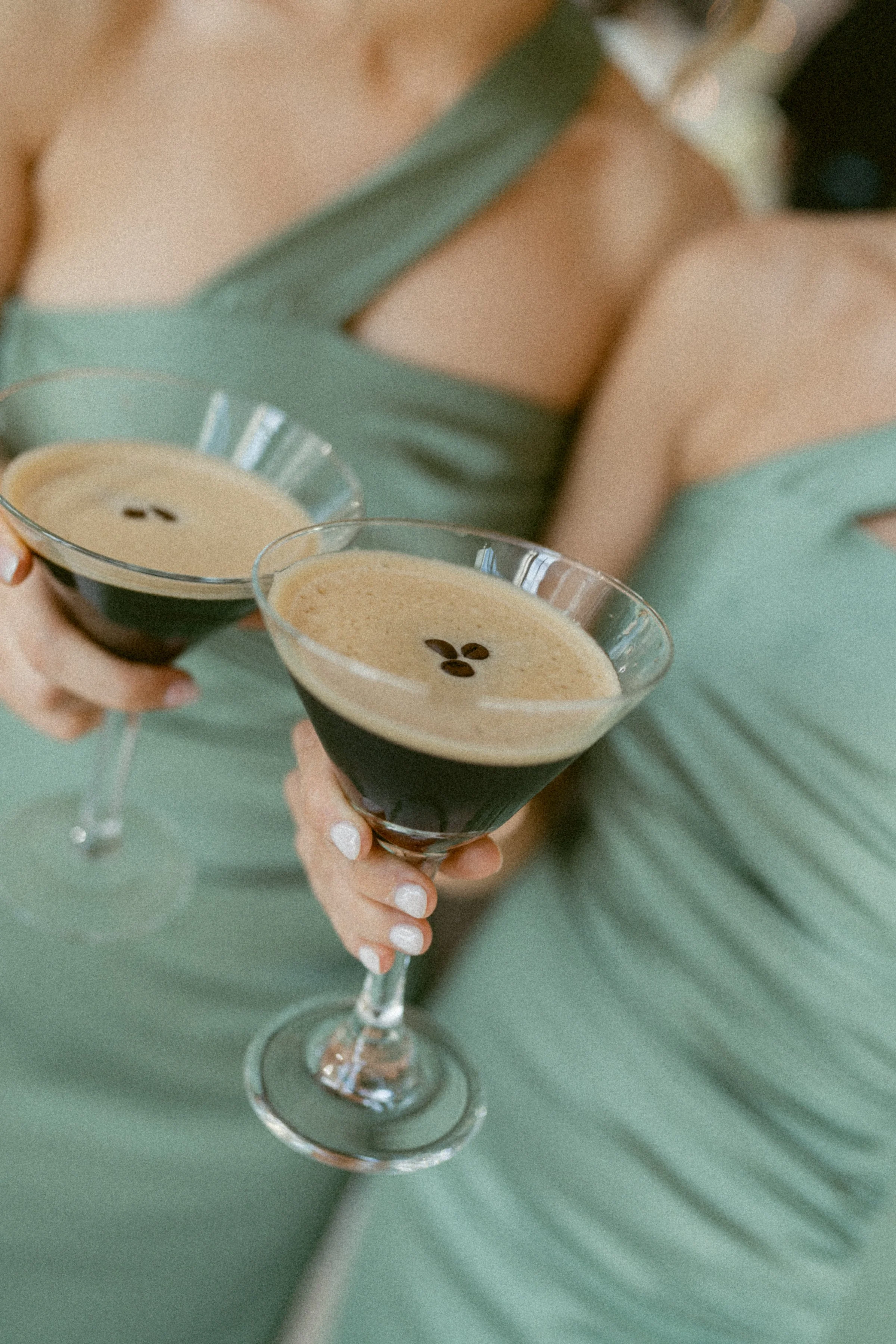 Bridesmaids holding espresso martinis in coupe glasses at Swaneset Bay Resort.