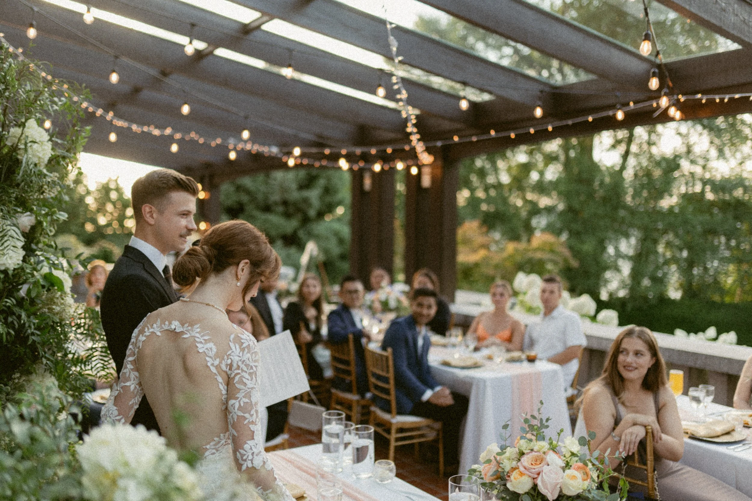 Bride and groom giving a toast at their wedding reception at Cecil Green.