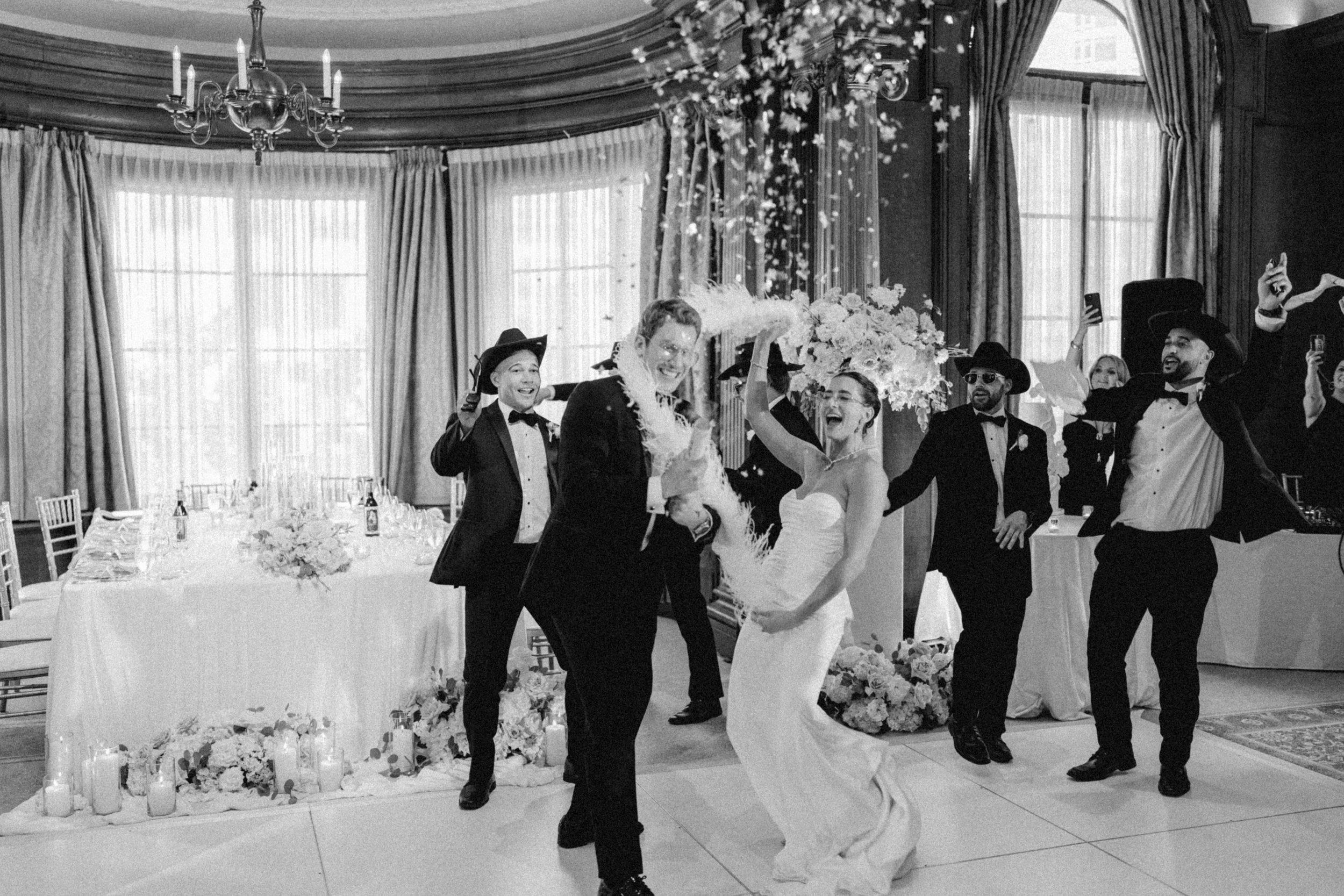 Bride and groom celebrating their reception entrance at the Vancouver Club.