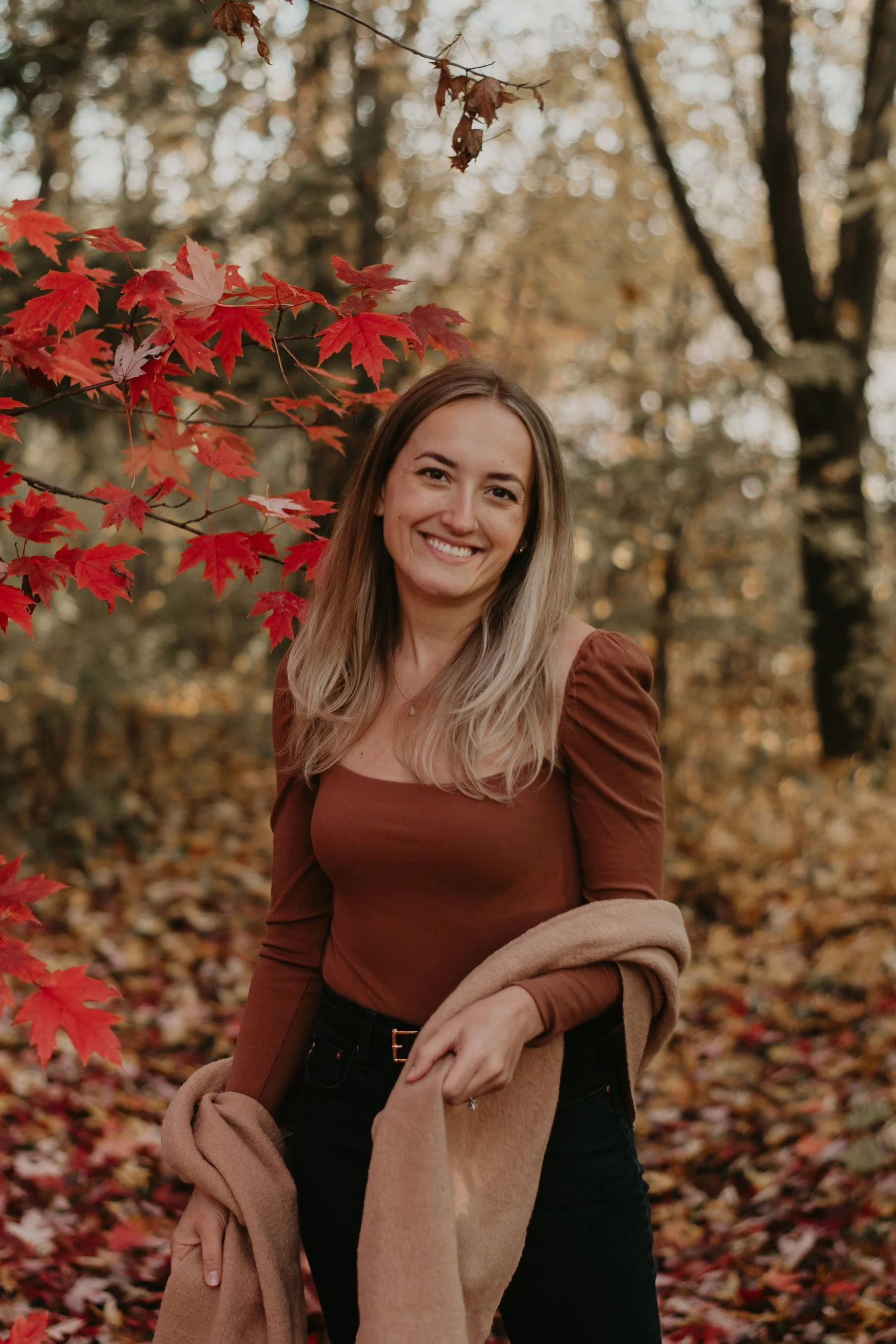 Nicole Argo-Ma, integrative women's health nurse practitioner in Ontario, professional photo among autumn leaves