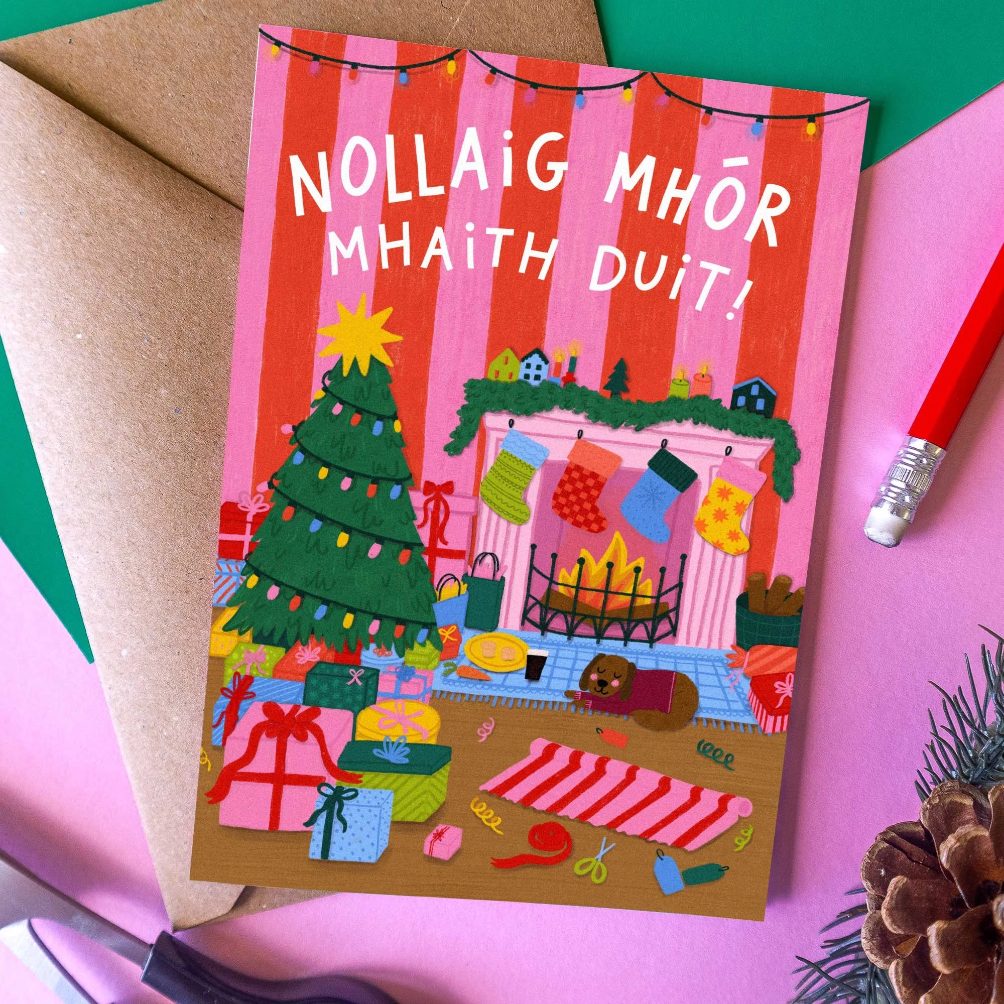 Hand illustrated Irish Christmas scene with Christmas tree, stockings, presents and Nollaig Mhór Mhaith Duit lettering