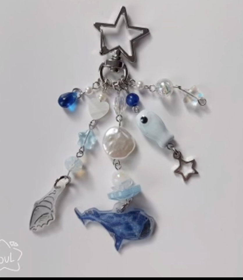 Keychain with star, crystal, shell, and whale charms