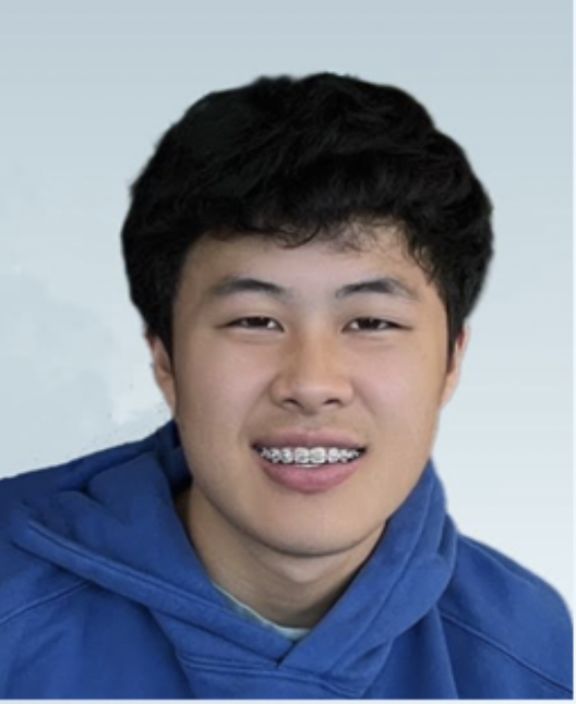 Person wearing a blue hoodie and braces, smiling at the camera against a light blue background.