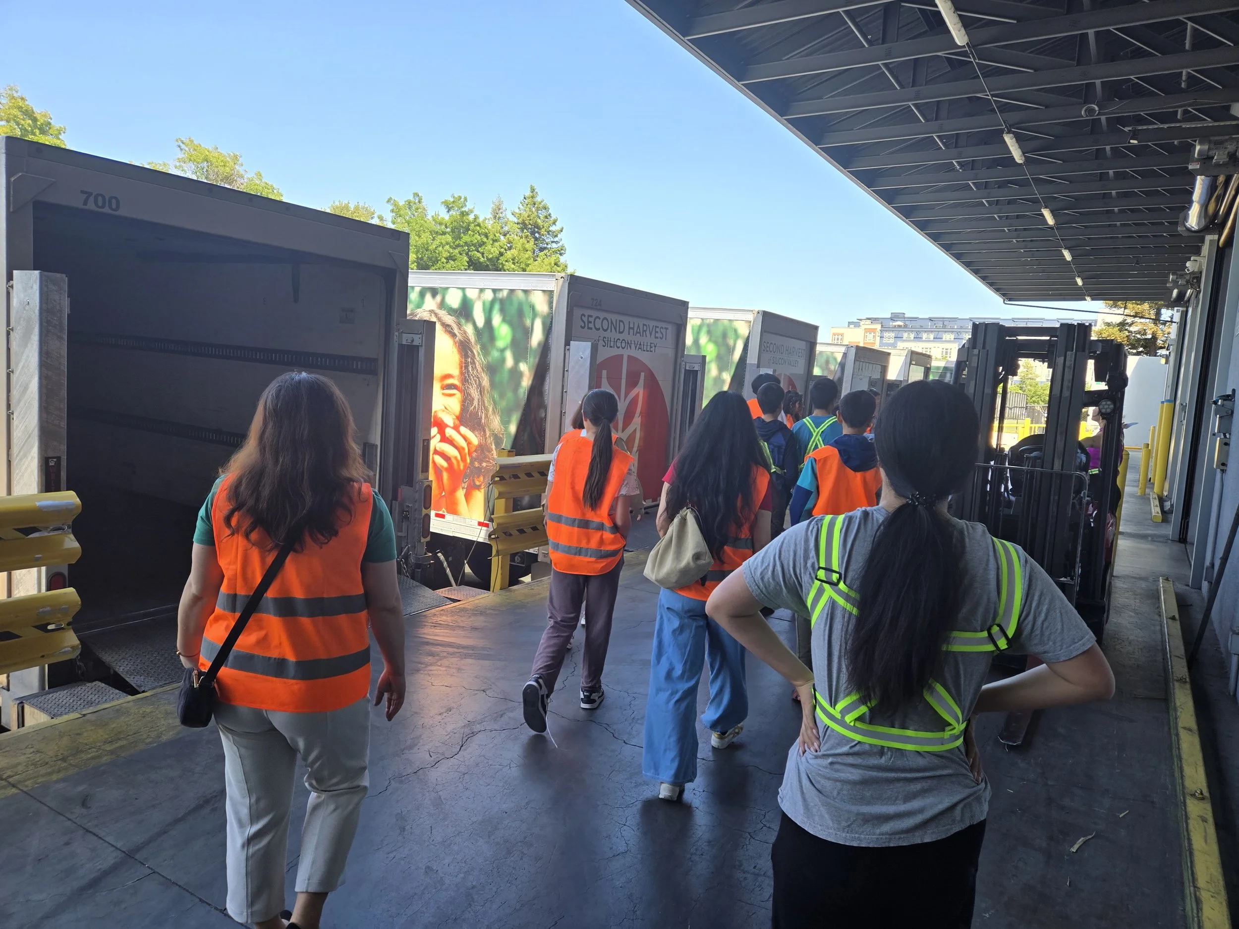  We are walking towards the trucks. 