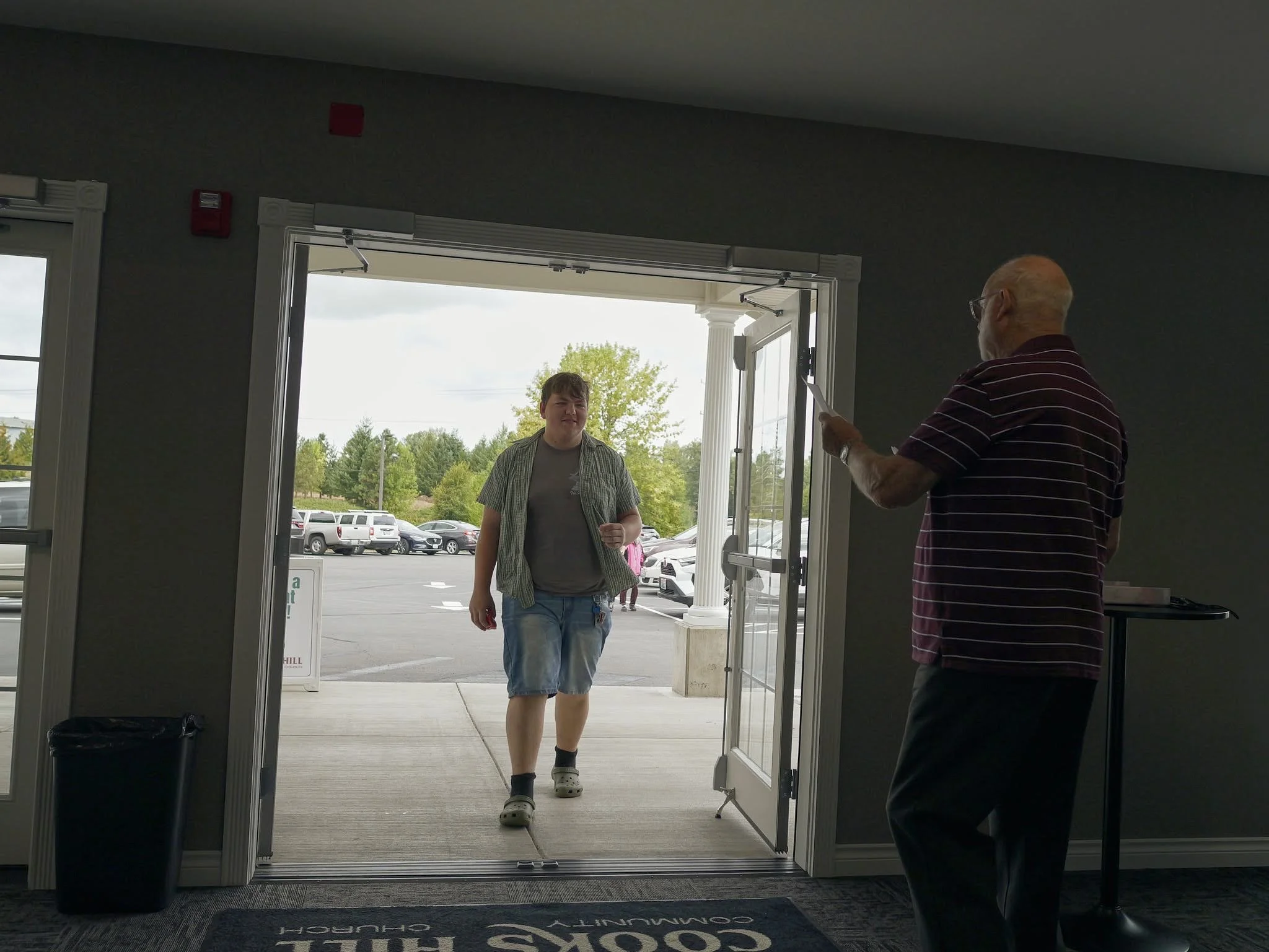 People welcoming to church