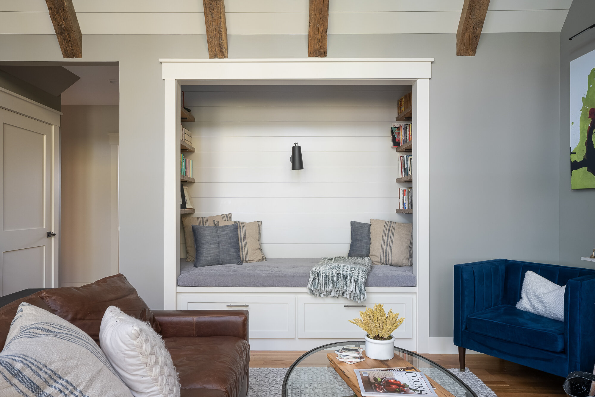 Architectural photography of a reading nook built into living room wall