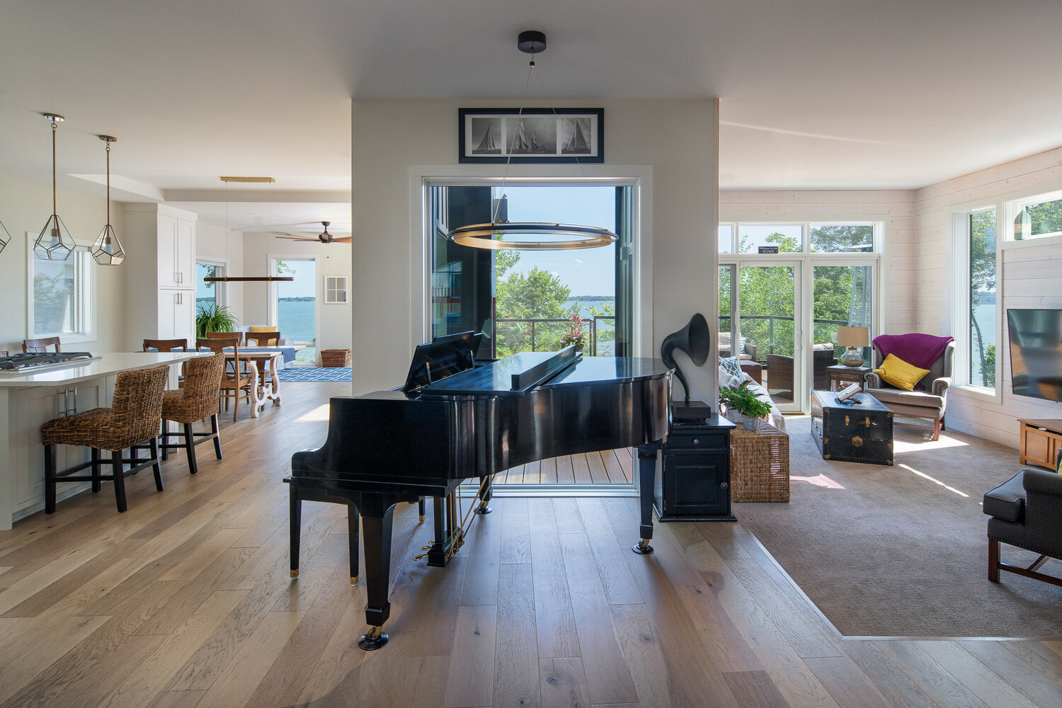 Modern living space lake home with grand piano